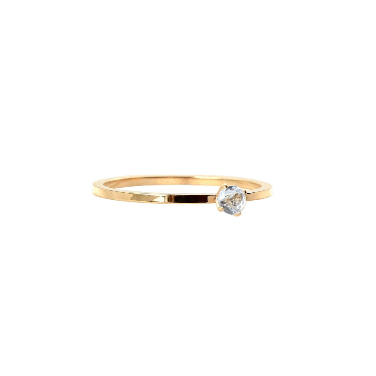Gold ring with a diamond on a white background