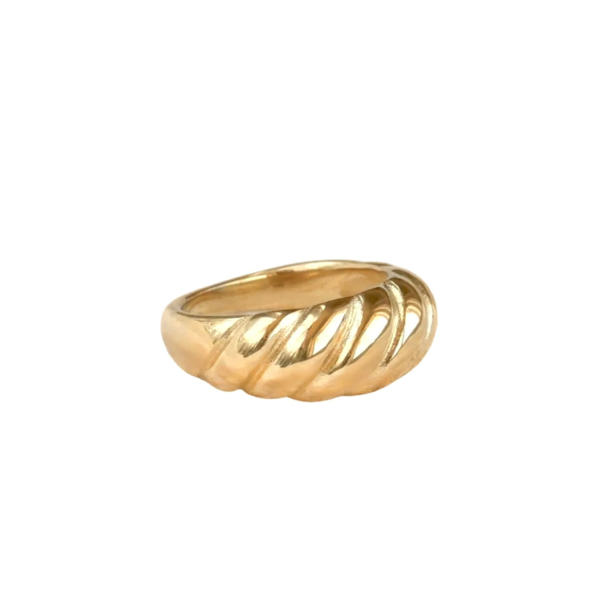 Gold croissant-shape ring on a white background