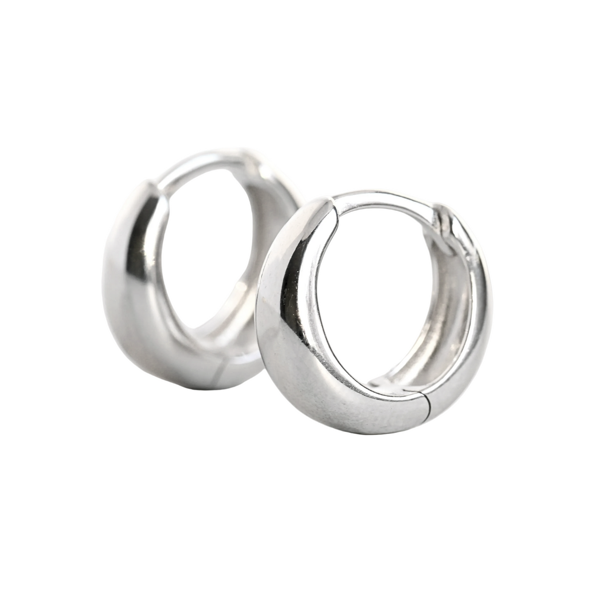Pair of thick silver hoop earrings on a white background