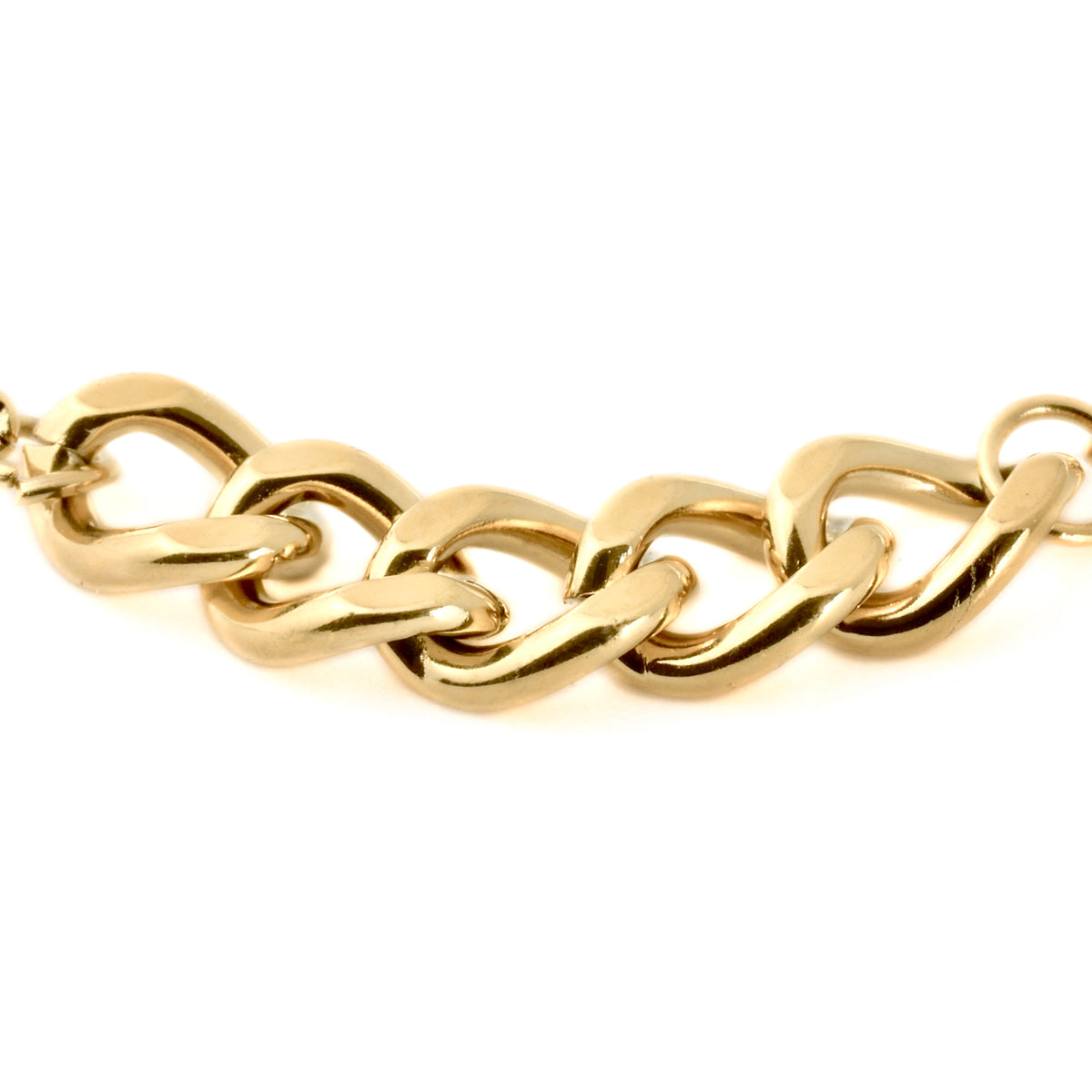 Close-up view of gold chain links in 5mm on a white background