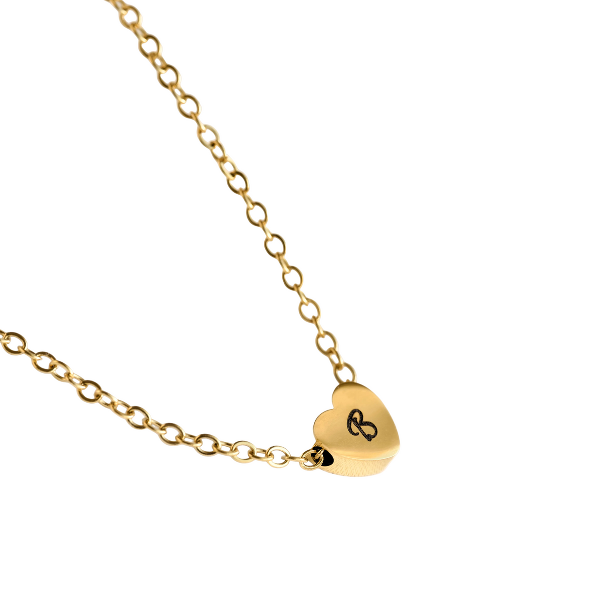 Gold heart necklace with a small pendant on a white background