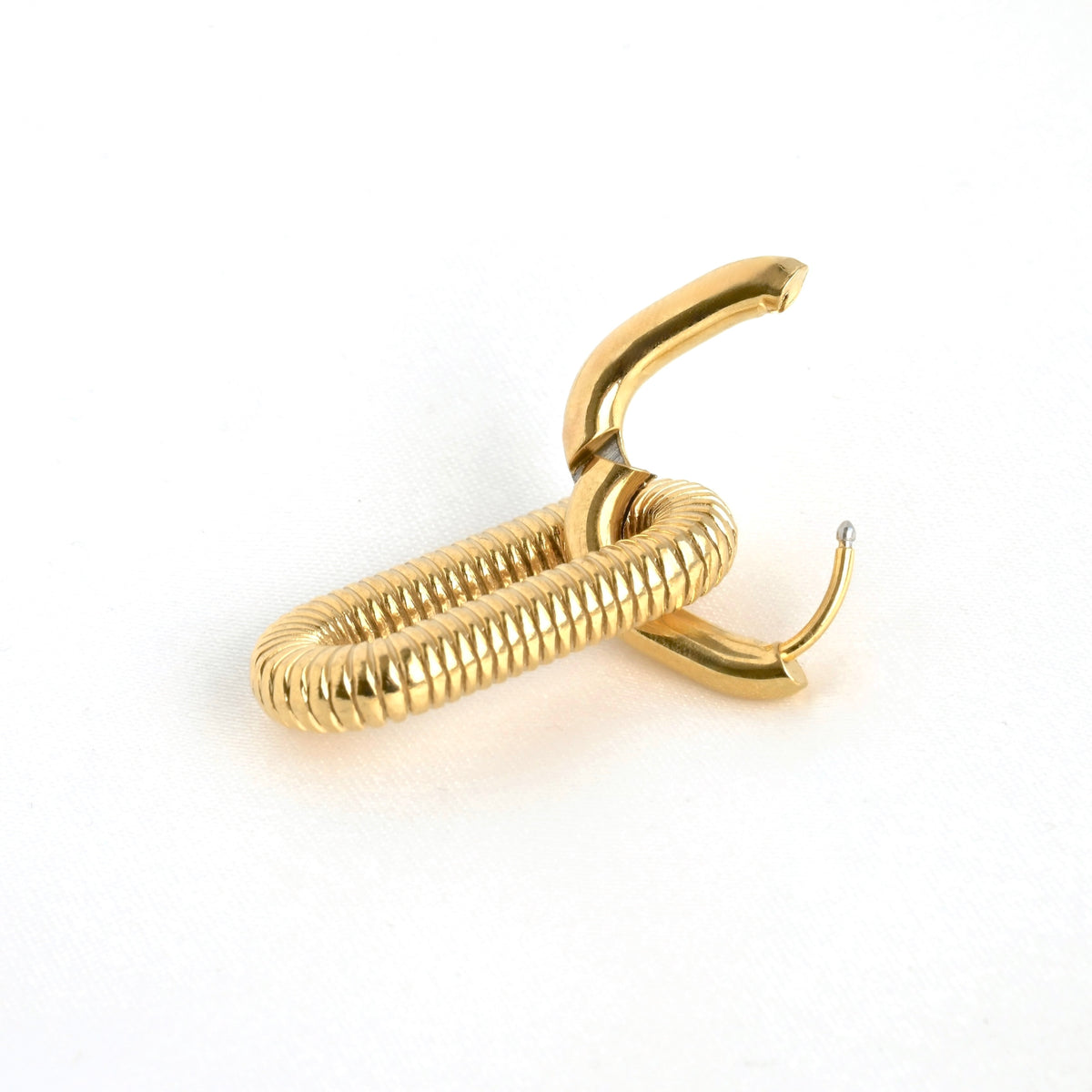 Close up of double paperclip chain link hoops with the top hoop open, showing the snap hinge closure.
