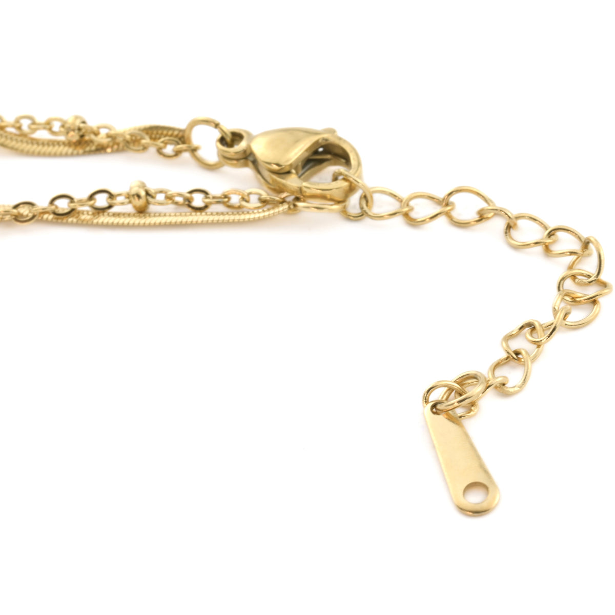 The clasp area of gold anklet with lobster clasp and extender, showcasing the two chains linked together on a white background