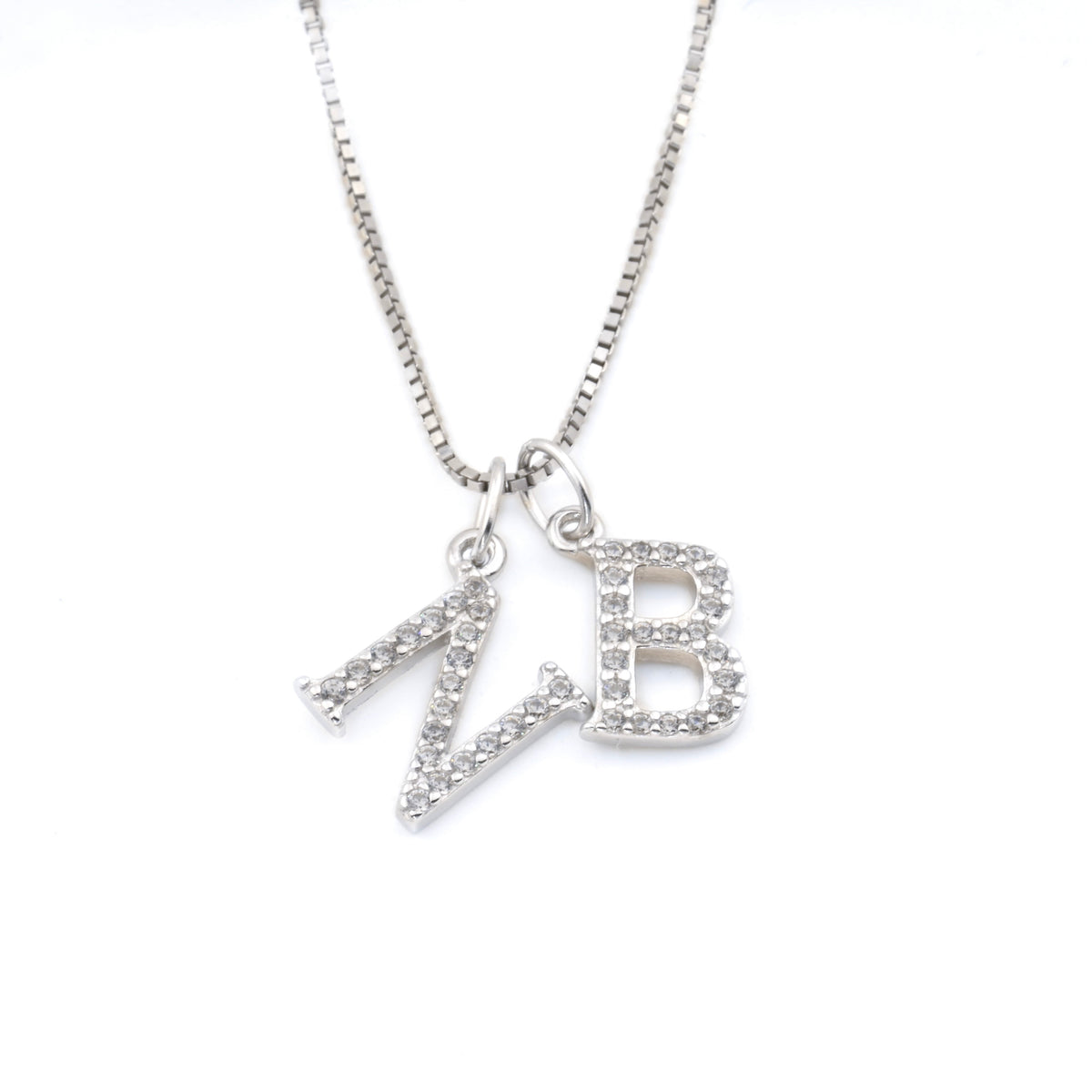 Silver box chain necklace with two initial charms on a white background