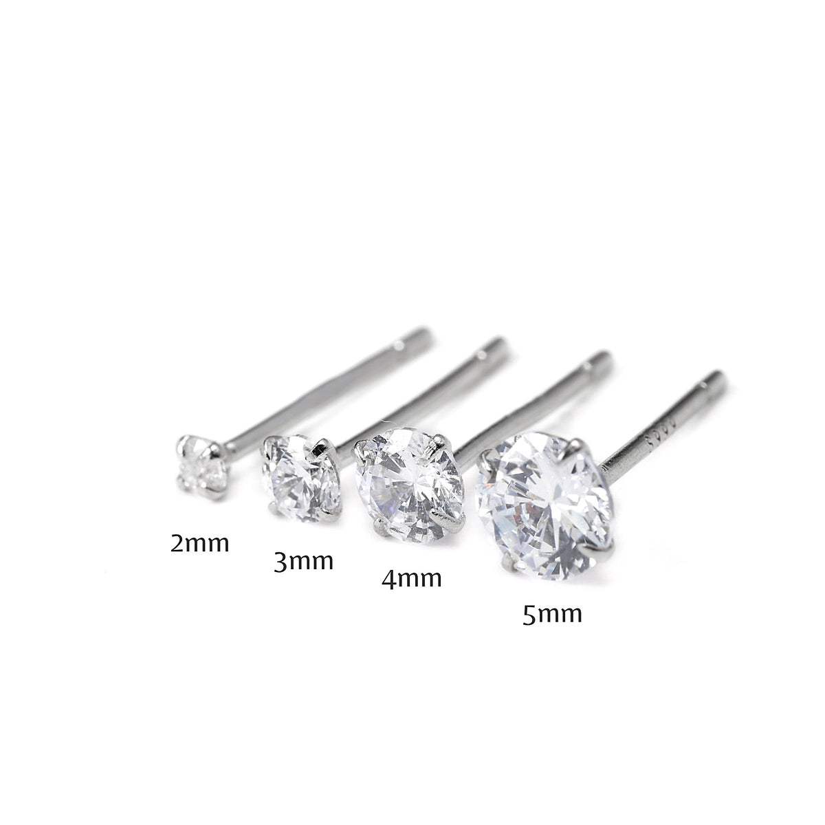 Set of four silver stud earrings with varying diamond sizes, 2 to 5mm, on a white background