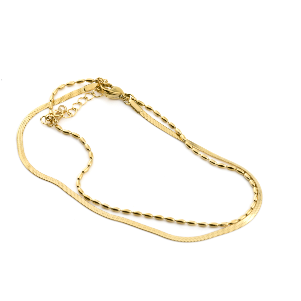 Double-layered gold ankle bracelet on a white background
