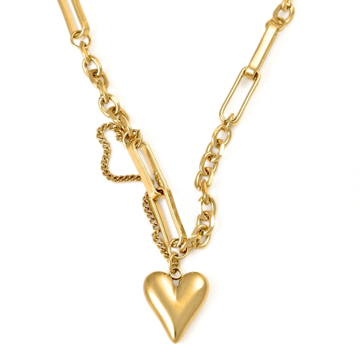 A gold-toned bracelet featuring a combination of paperclip , rolo and curb chain styles, with a medium heart-shaped charm at the center, shown against a plain white background.