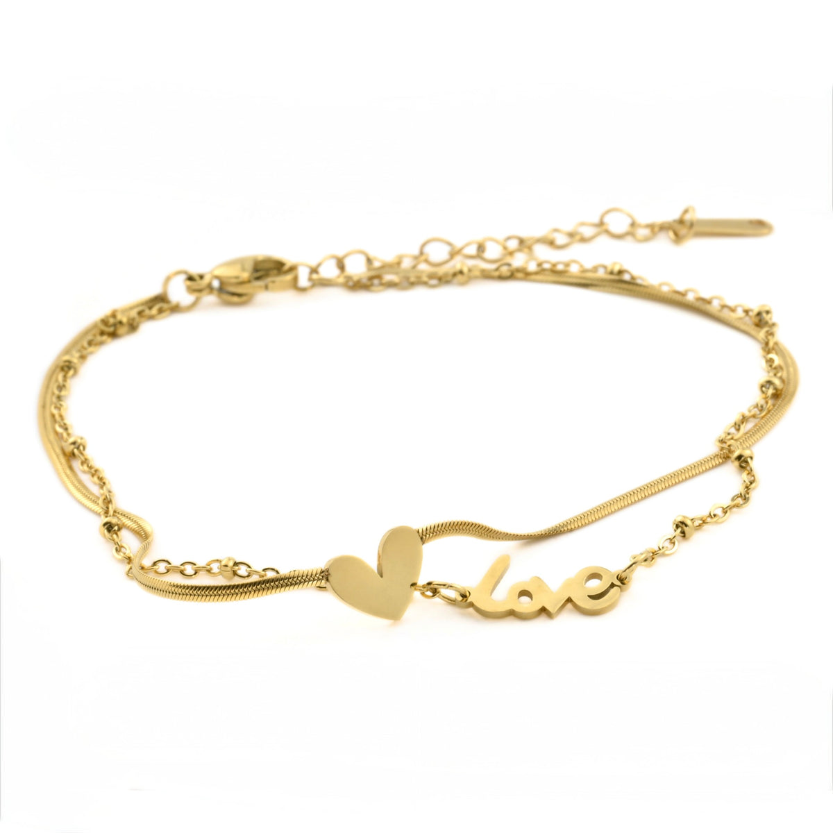 Gold ankle bracelet with heart on a thin herringbone chain and 'love' on a satellite chain charm on a white background