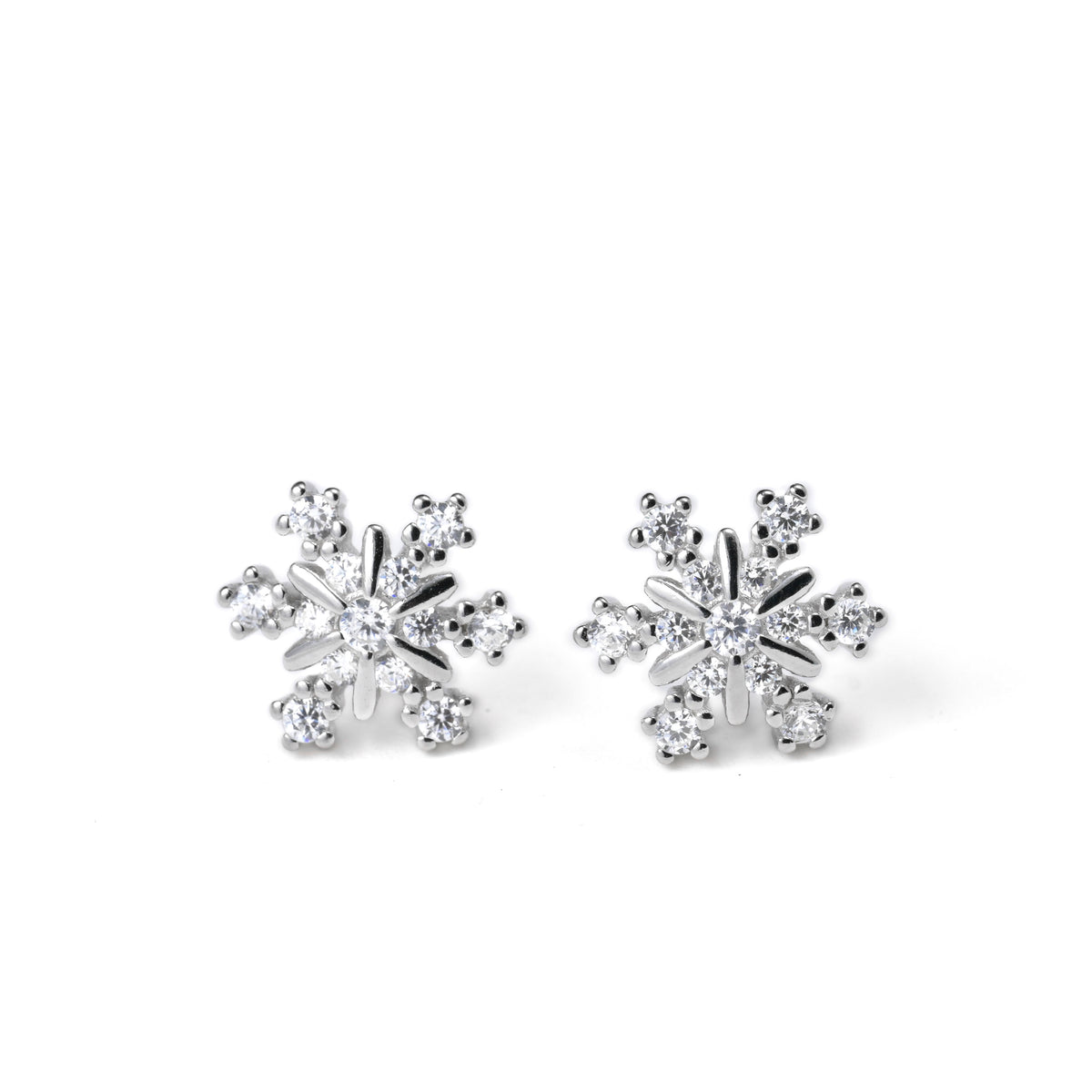 front view of silver snowflake earrings with crystals on a white background