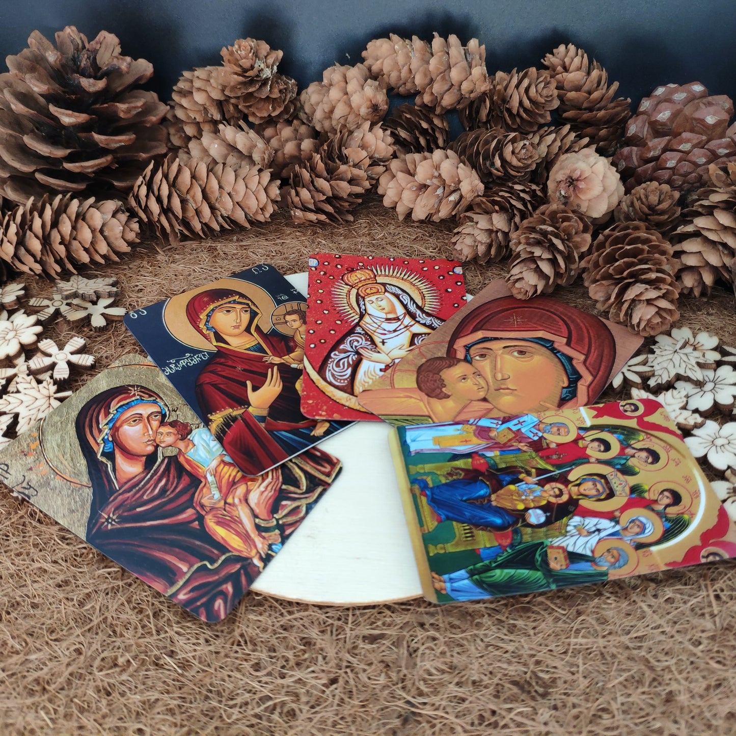 Set of magnets with Orthodox Christian icons on a textured surface