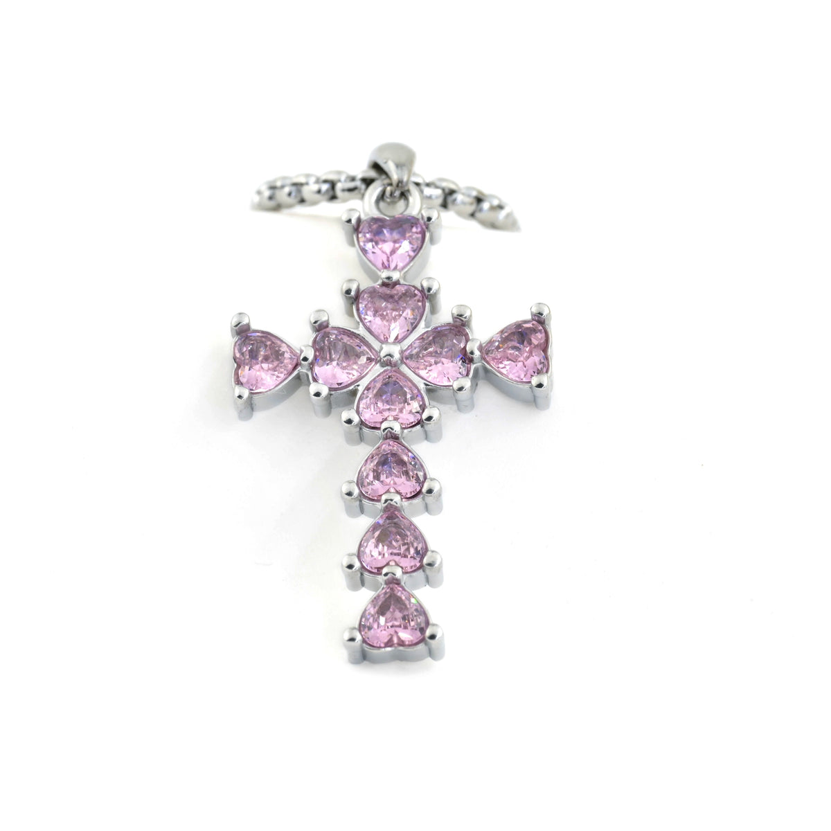 Silver cross pendant with pink gemstones on a white background