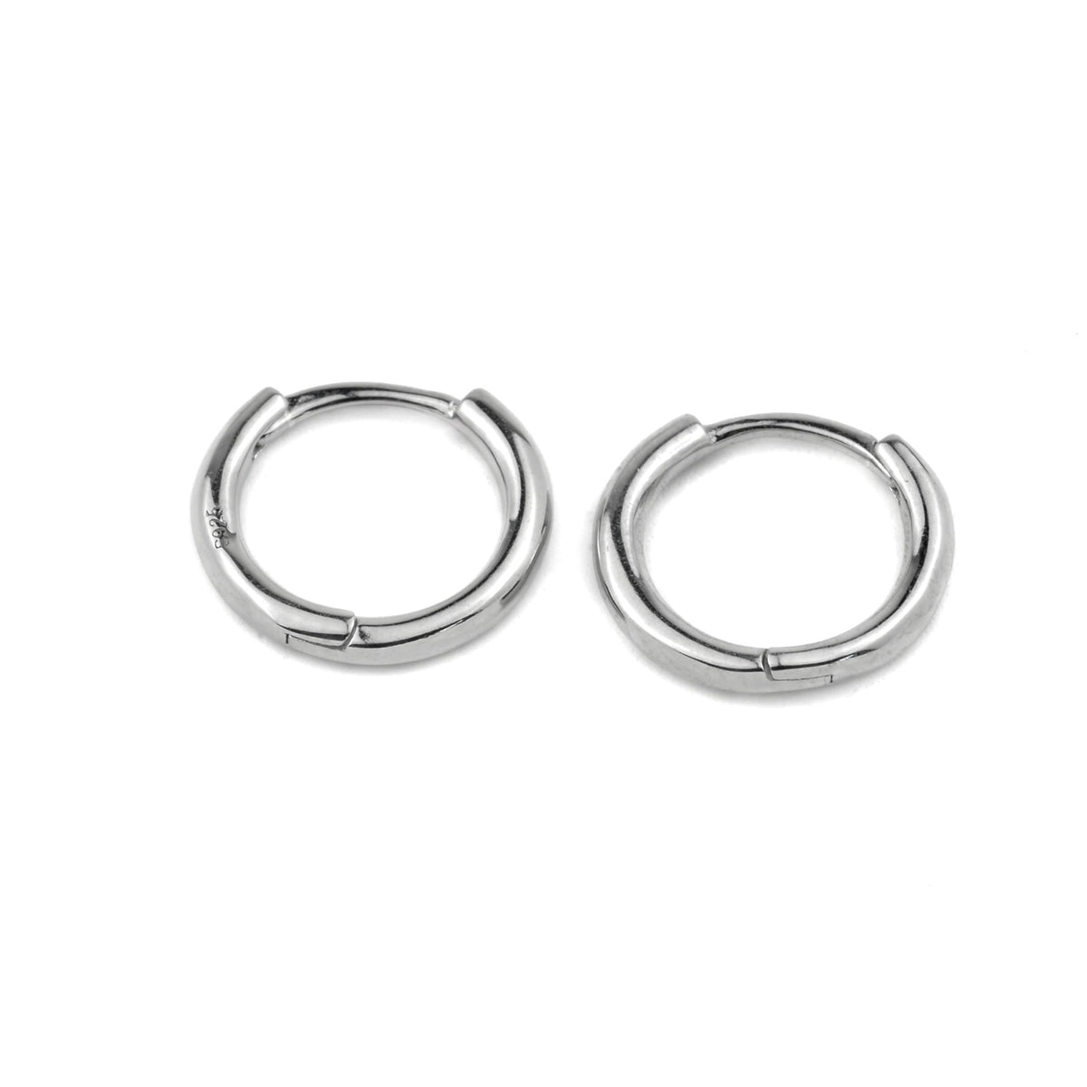 Pair of silver classic hoop earrings on a white background