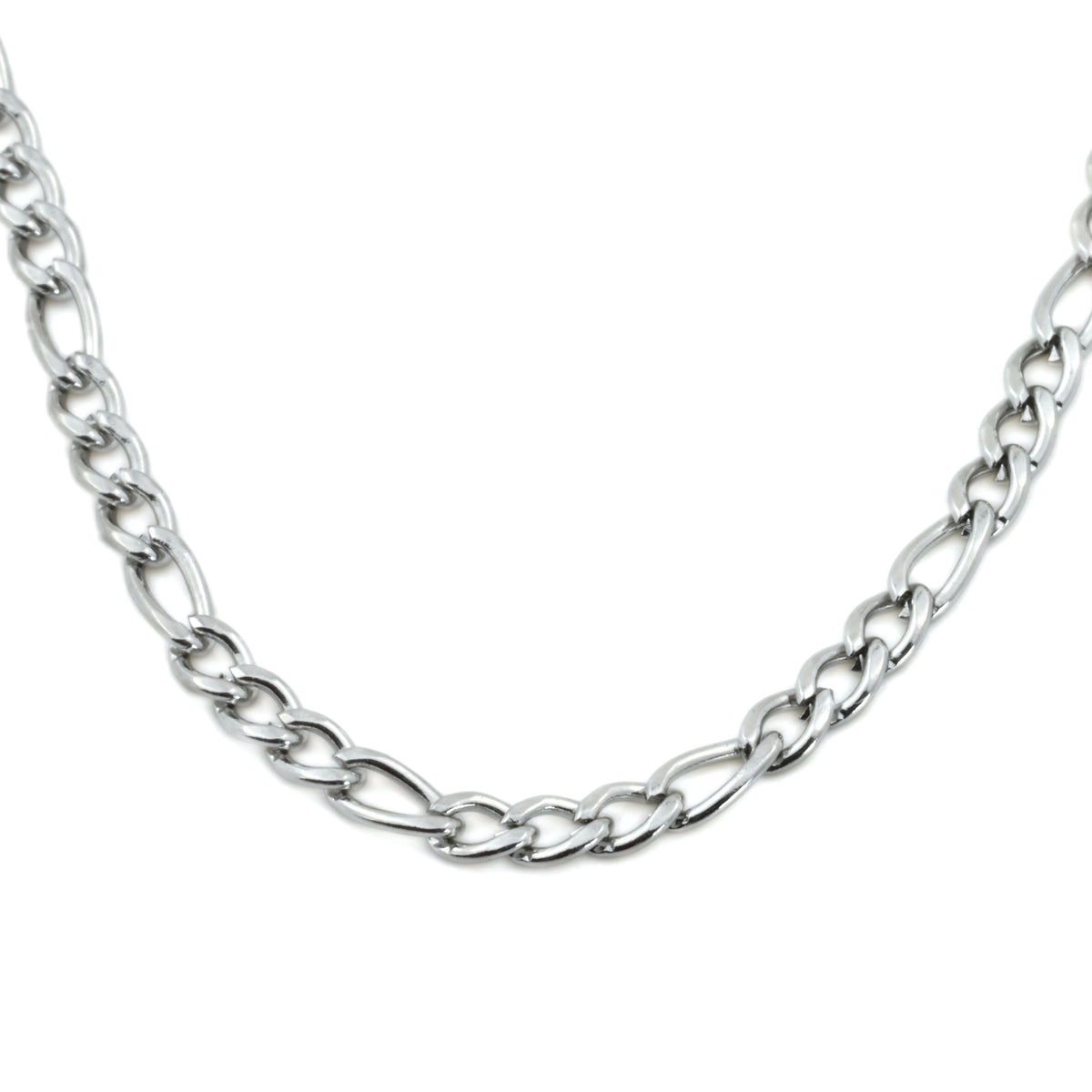 Close up view of silver figaro necklace showing alternating big an small links on a white background