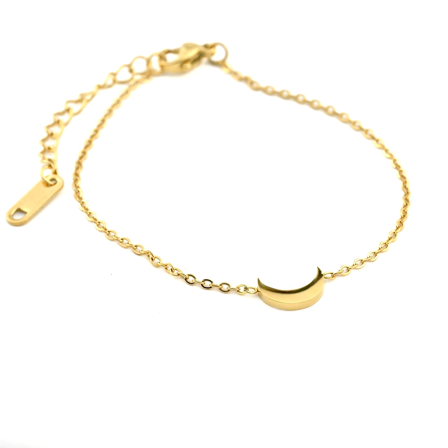 Gold bracelet with a crescent moon charm on a white background