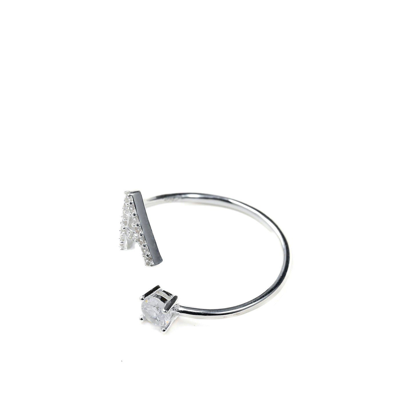 Silver bypass ring with letter 'A' and round gemstone in a four prong setting on a white background