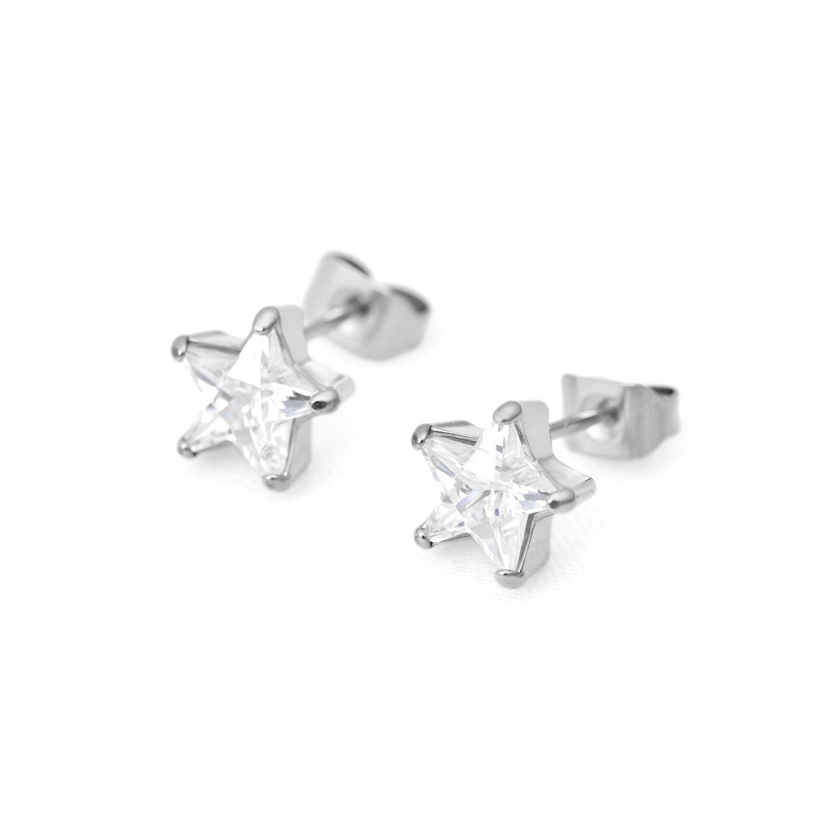 A pair of silver star-shaped stud earrings with clear star-cut cubic zirconia, shown on a plain white background.