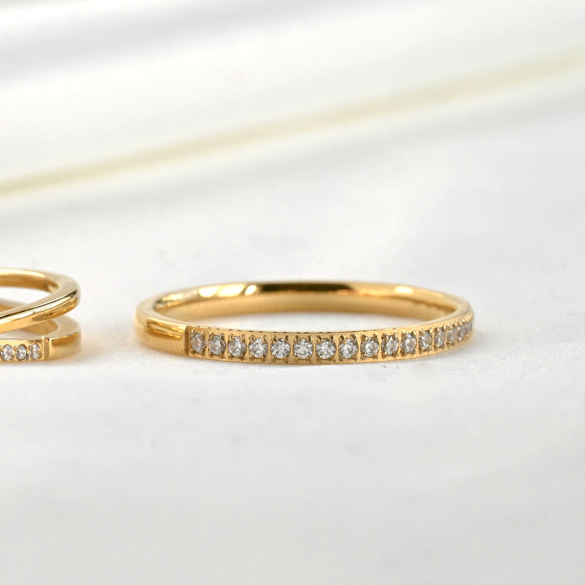 Close-up view of half eternity band with the front side embedded with stones