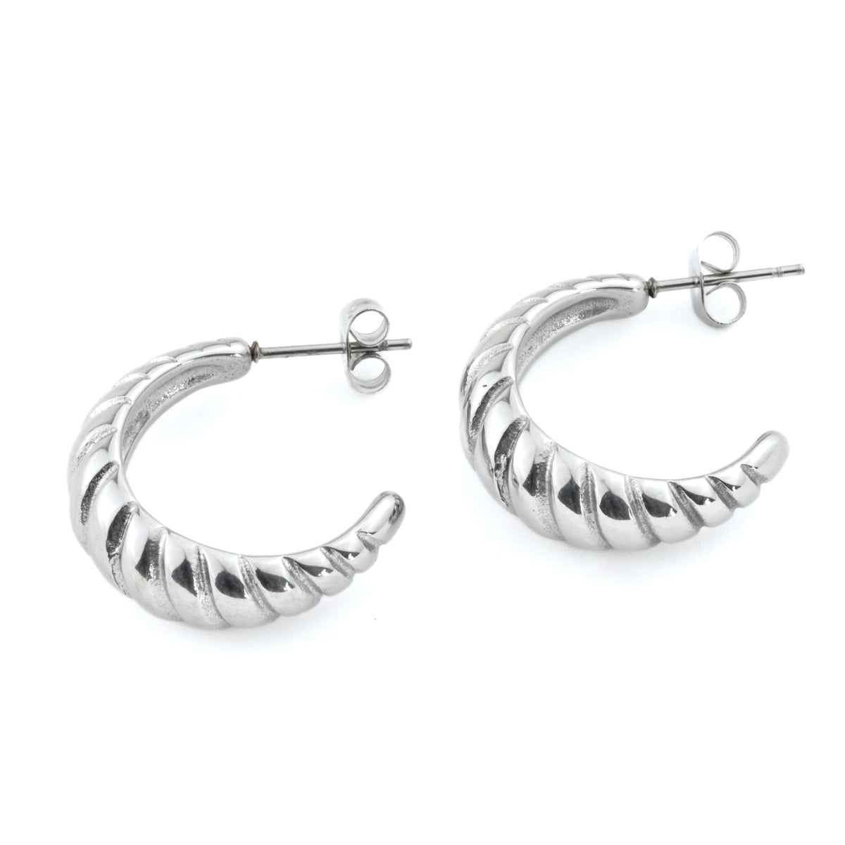 Silver hoop earrings with a ribbed texture on a white background