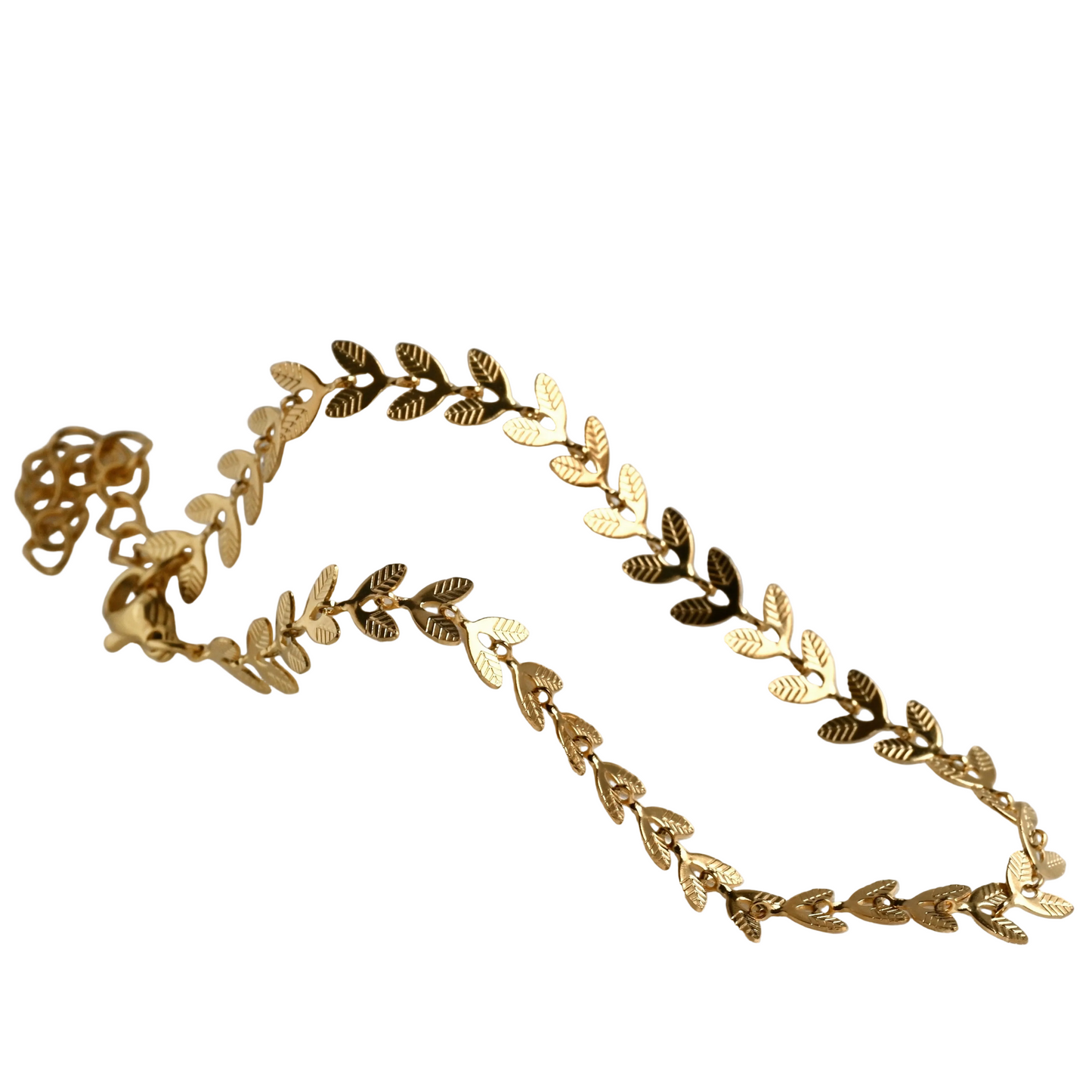 Gold leaf bracelet on a white surface
