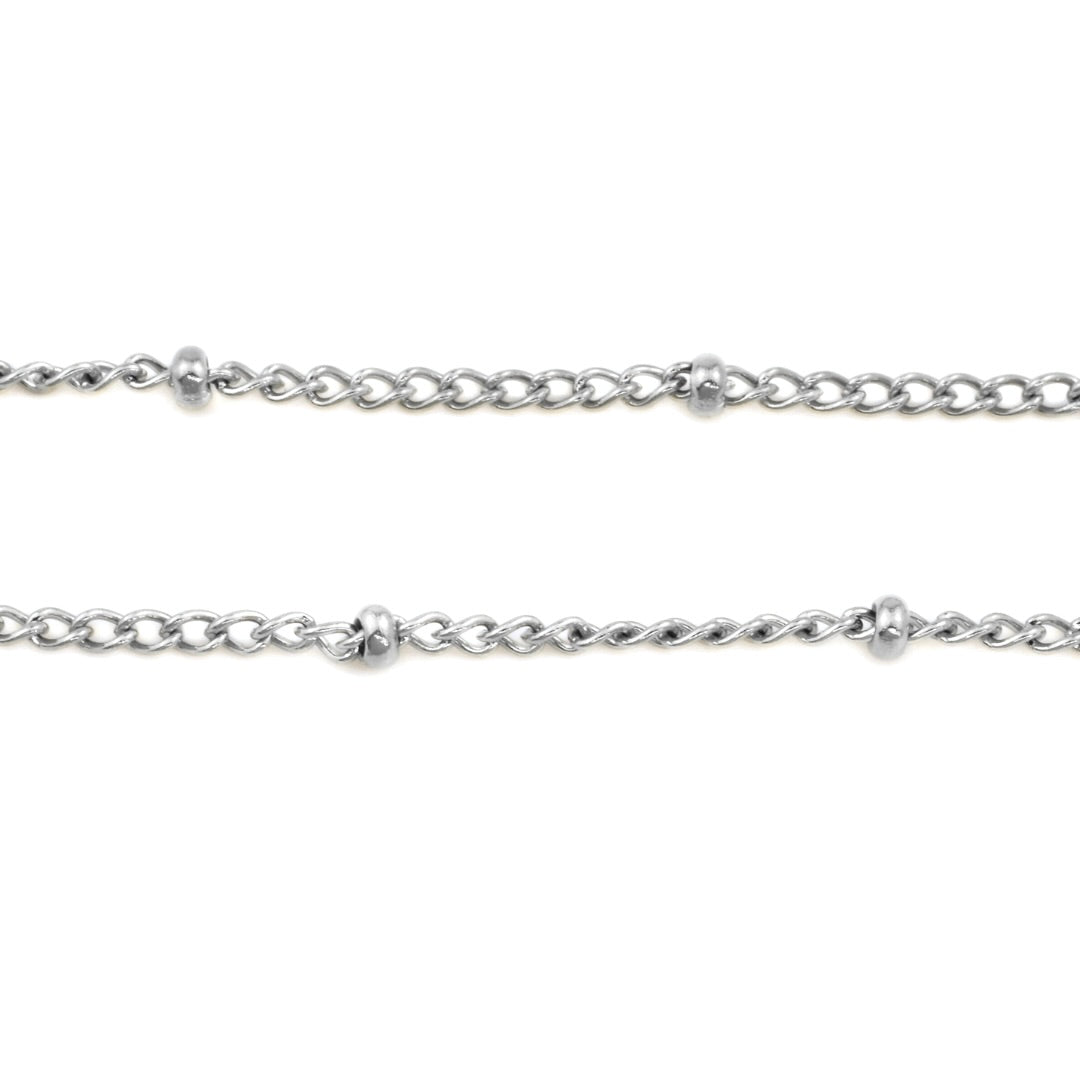 Close-up of a silver satellite chain on a white background