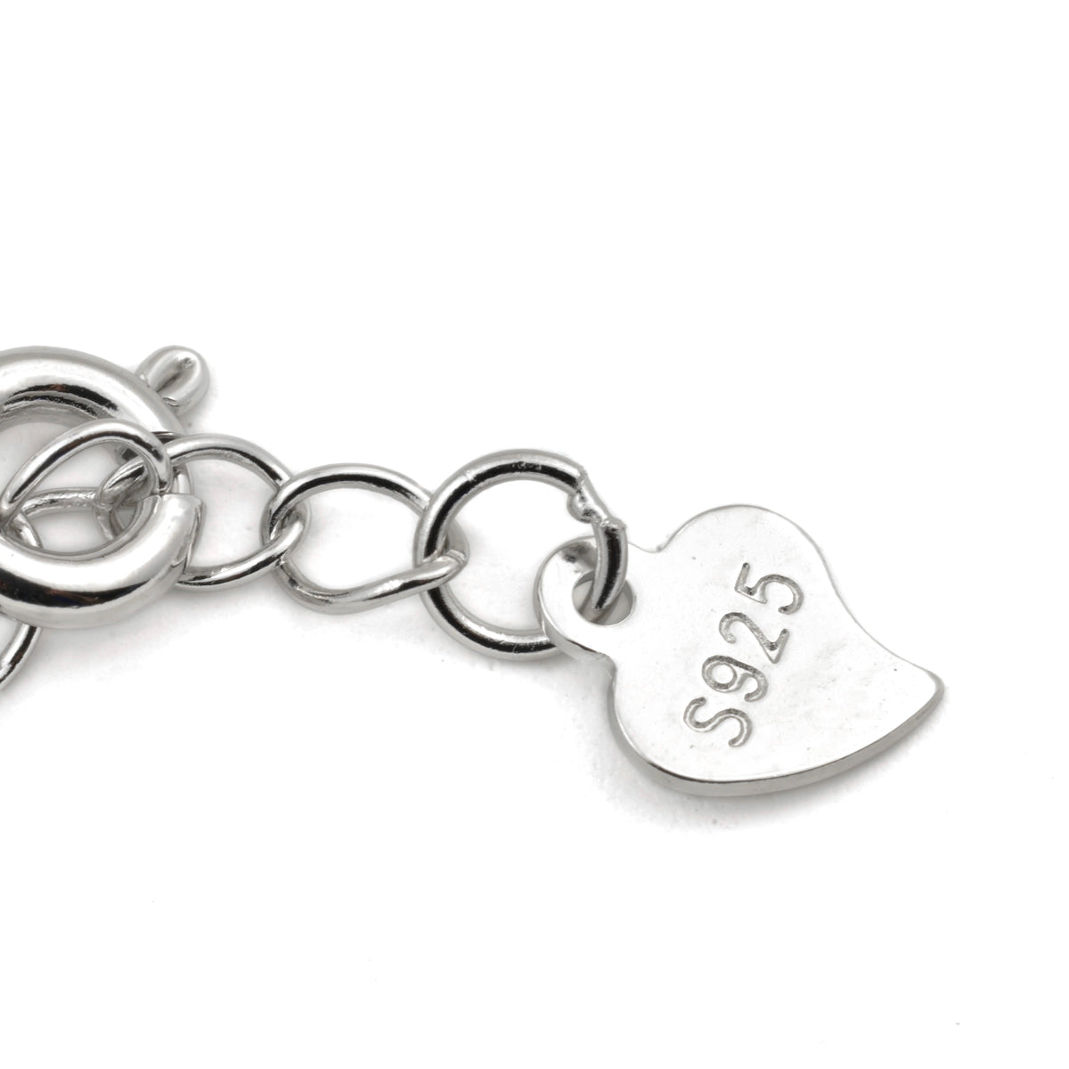 Close-up view of Silver necklace with a heart-shaped tag featuring 'S925' on a white background