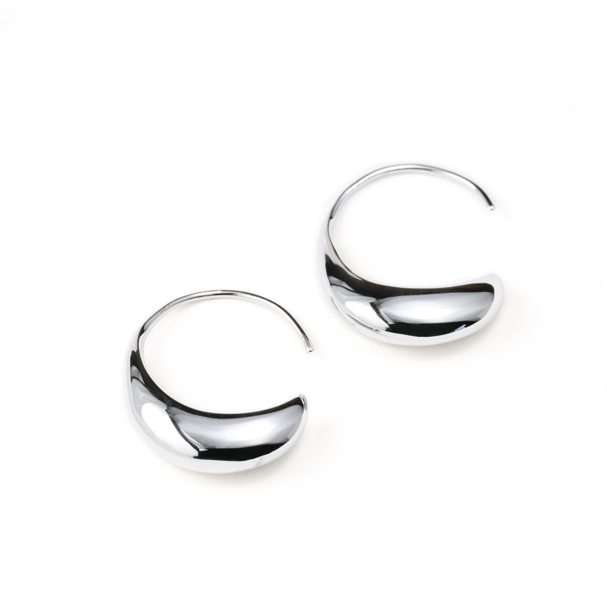 Pair of silver hook earrings on a white background