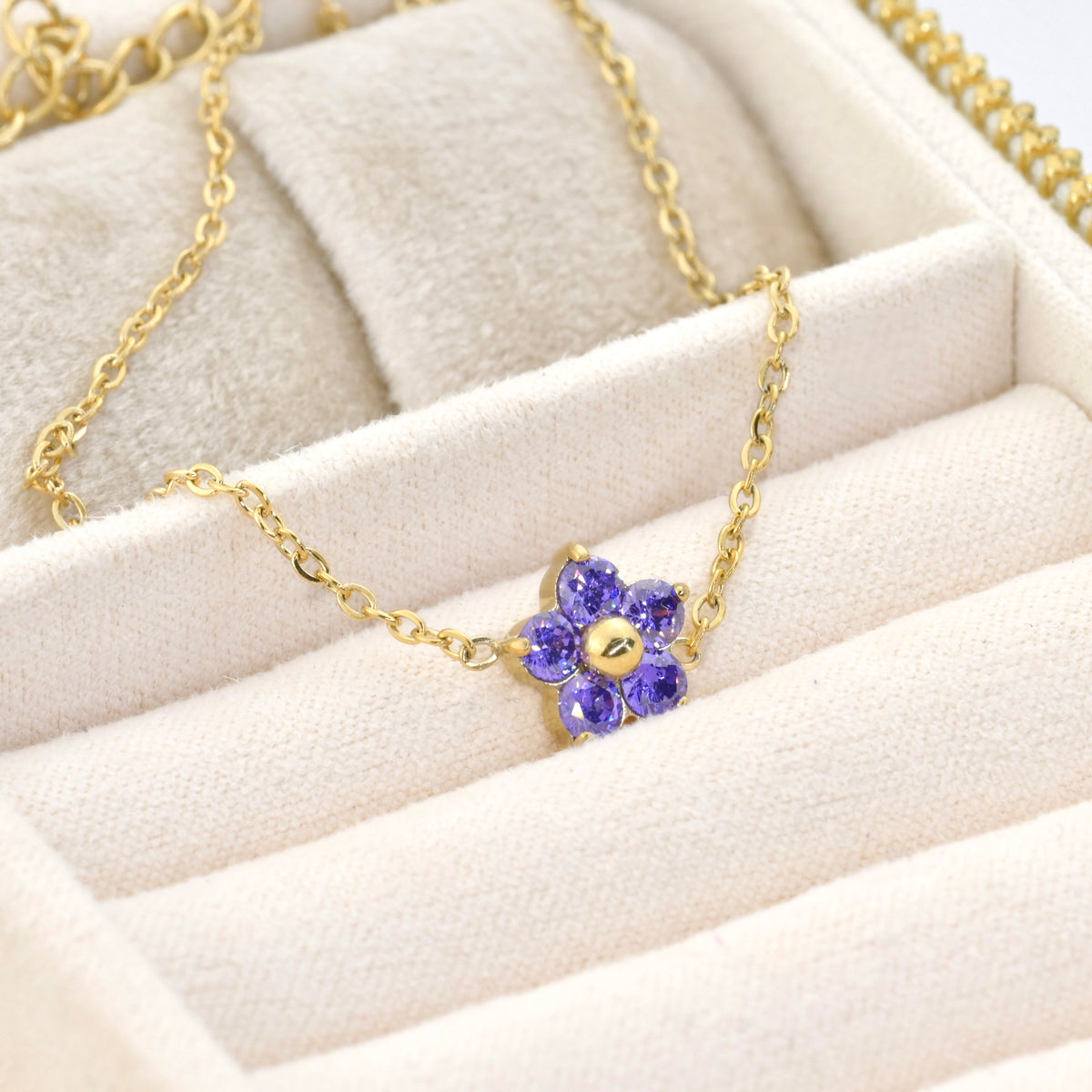 amethyst flower bracelet on a beige surface