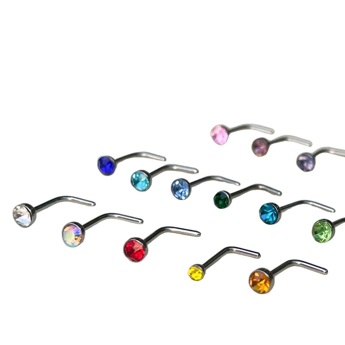 Set of nose rings with multicolored crystals on a white background