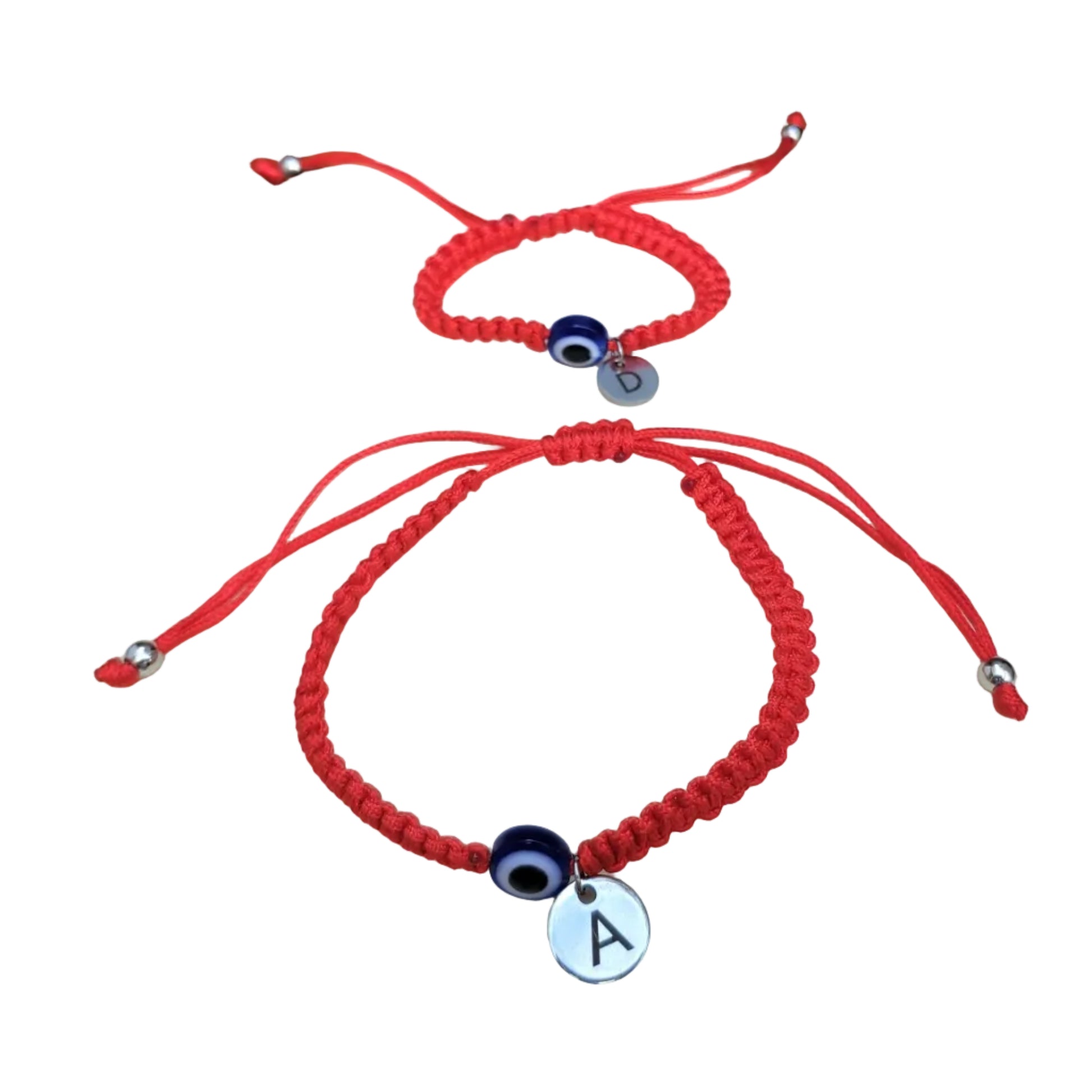 Two red evil eye bracelets with initial charms on a white background