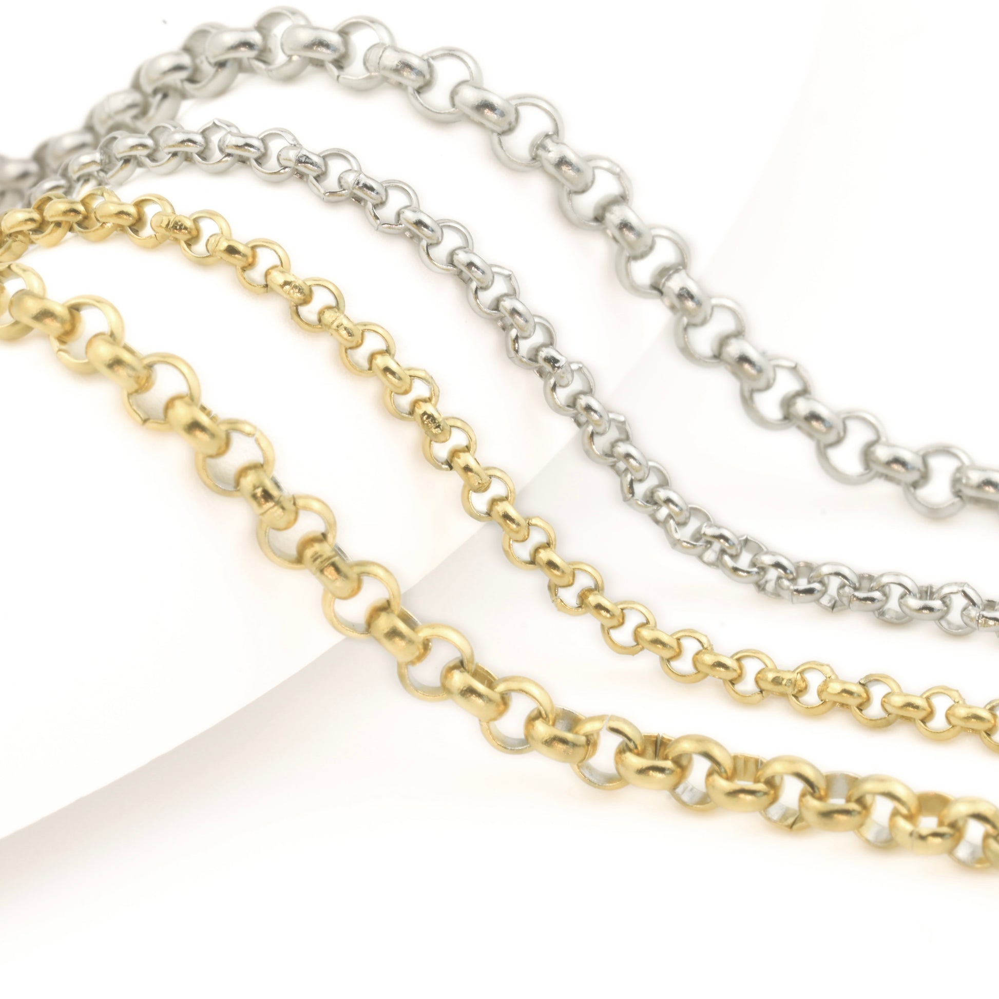 Two gold and silver chain necklaces in 2mm and 3mm widths on a white background