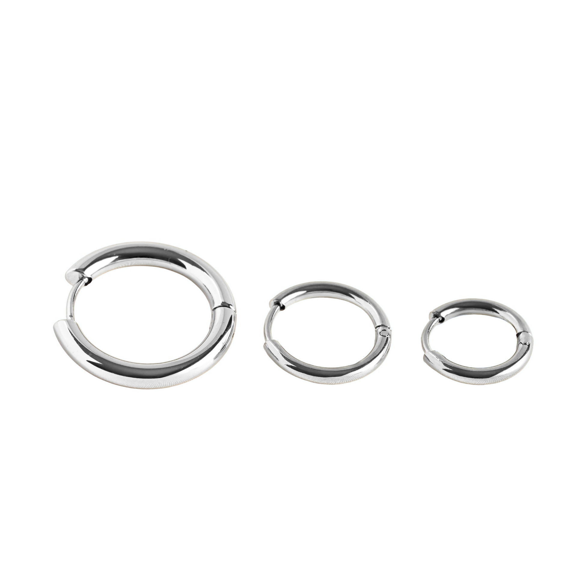 Close-up view of subtle silver hoop earrings with clicker closure in small, medium and large sizes on a white background