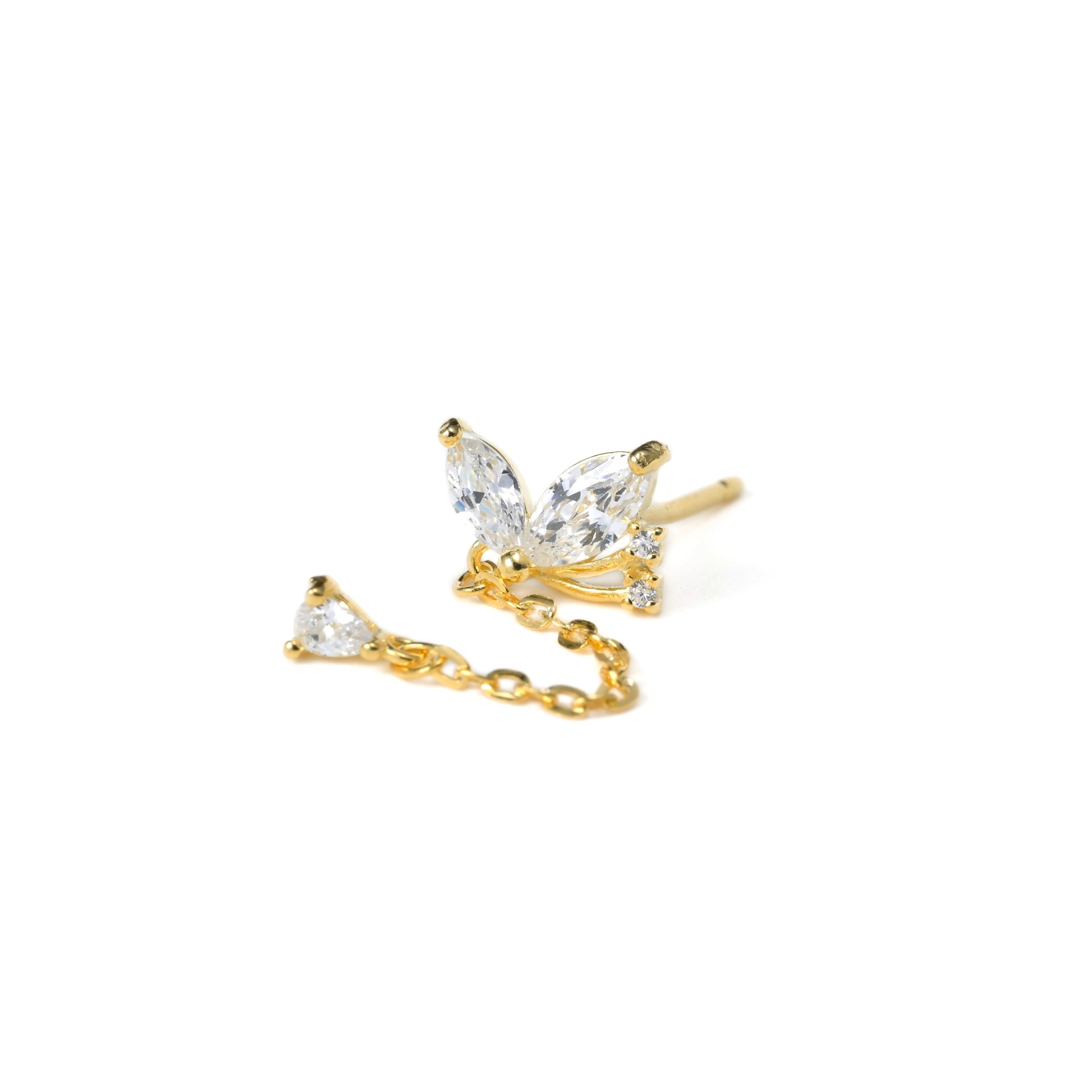 Gold and crystal stud earrings on a white background
