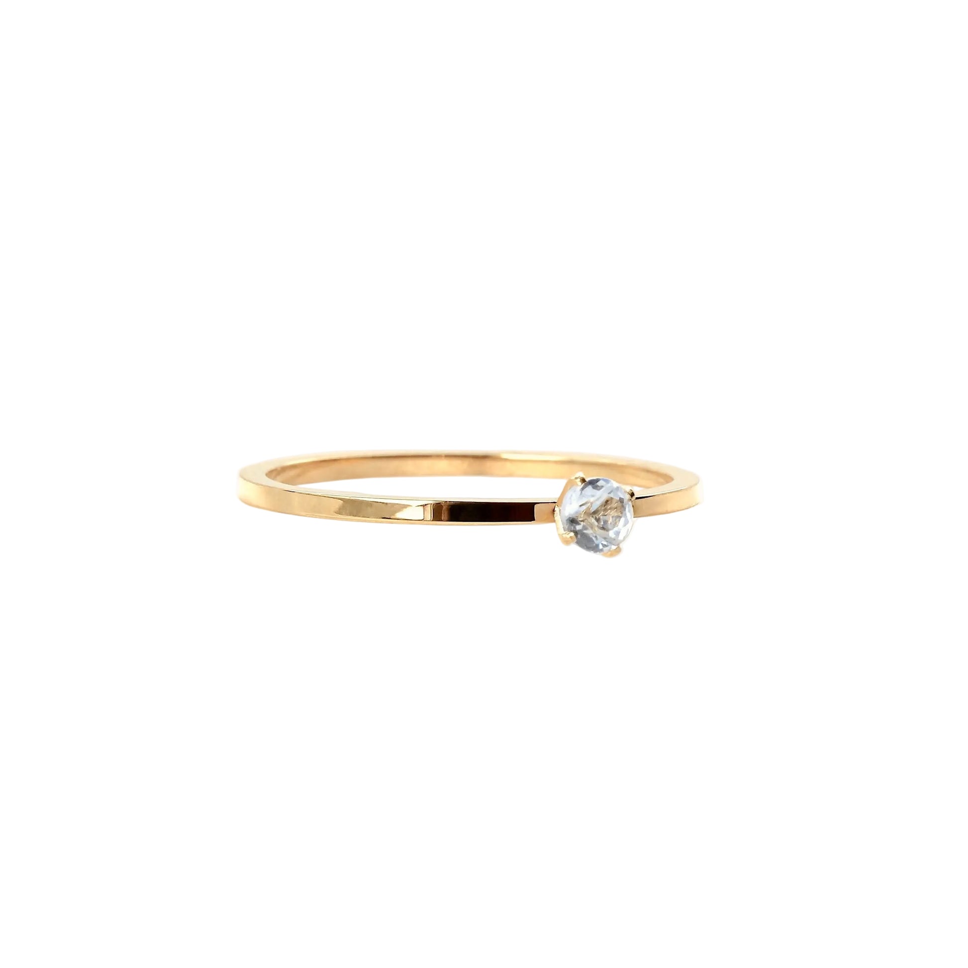 Gold ring with a diamond on a white background