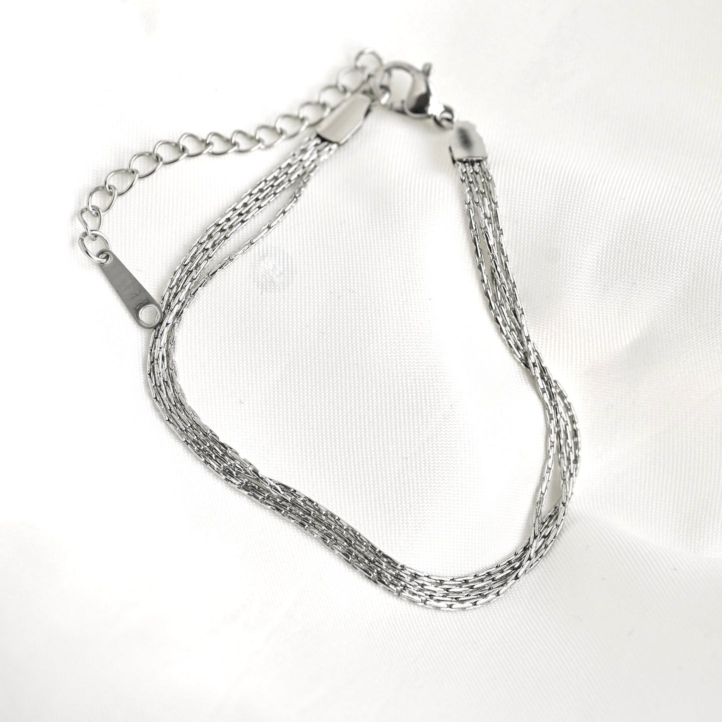 Silver chain bracelet on a white background