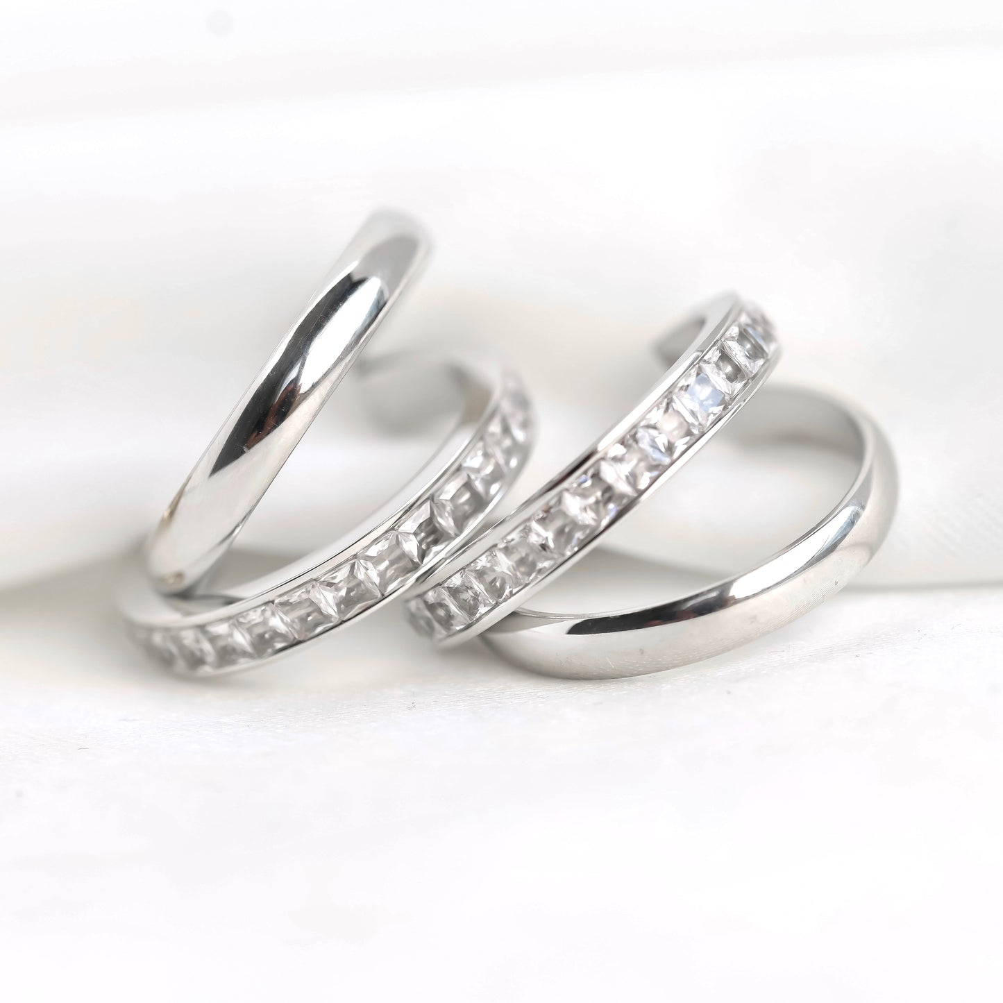 Double layered hoop earrings with diamond accents on a white background