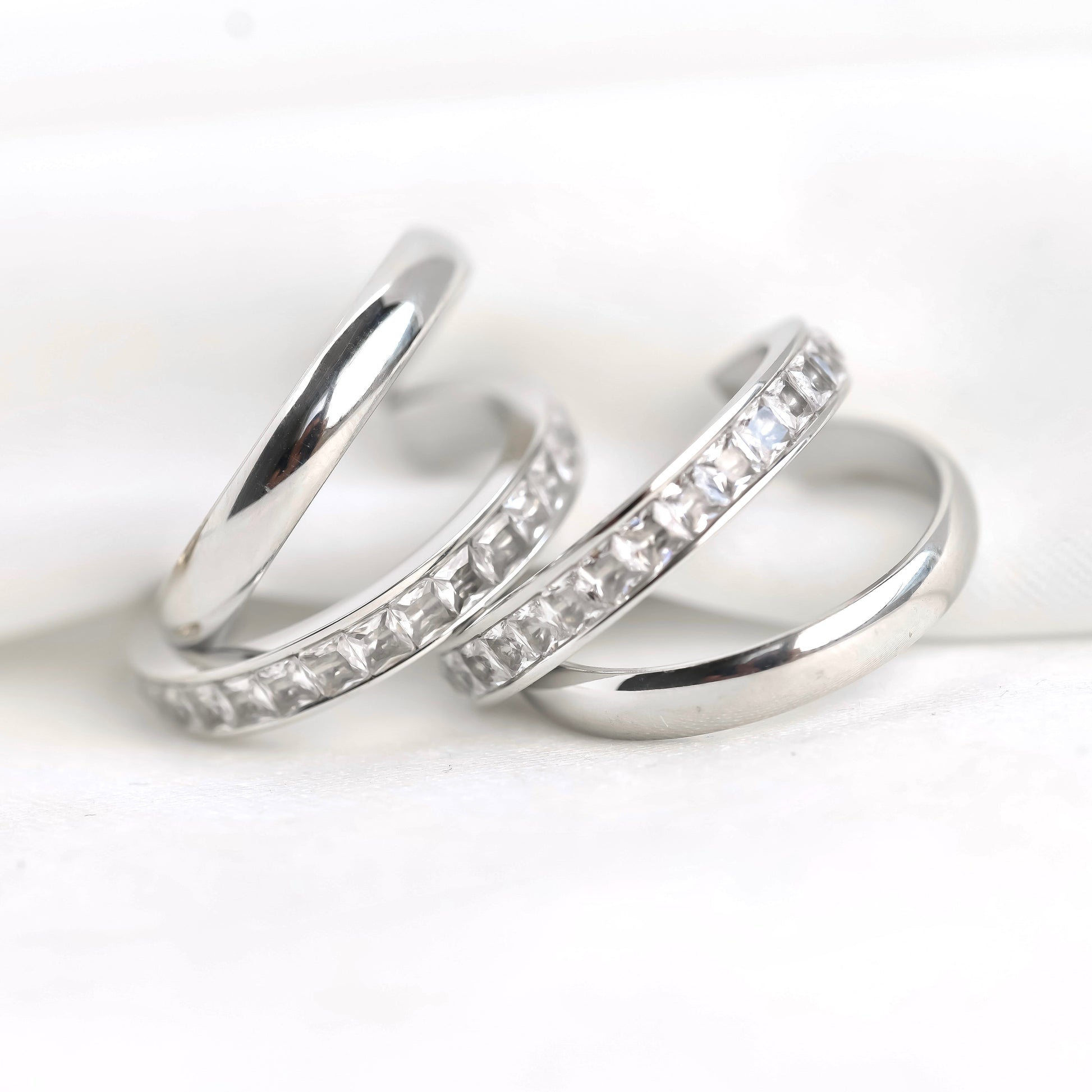 Double layered hoop earrings with diamond accents on a white background
