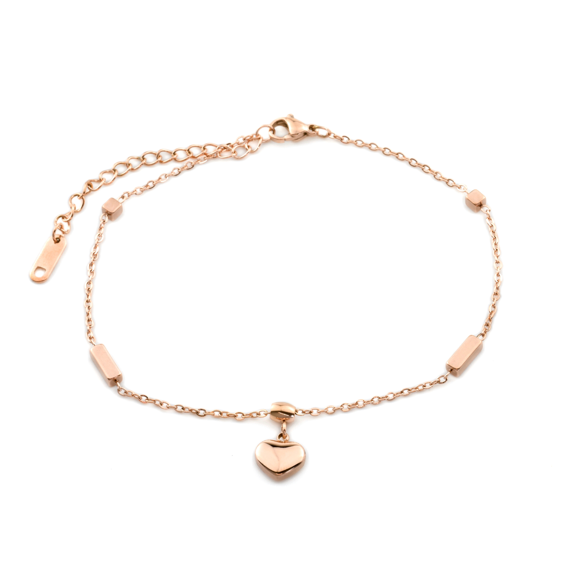 Rose gold anklet with heart charm and 3d rectangular and cube beads along a delicate cable chain on a white background