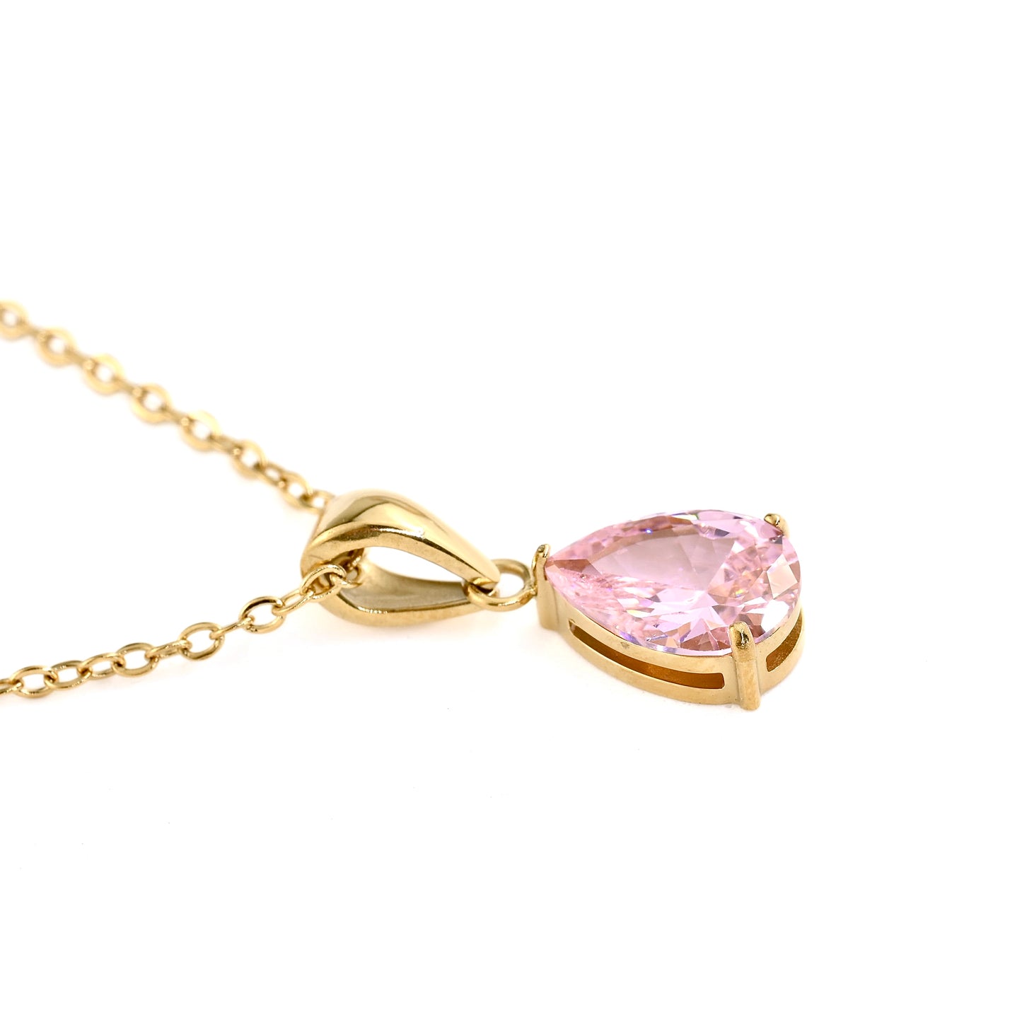 Gold necklace with a pink tourmaline teardrop pendant on a white background