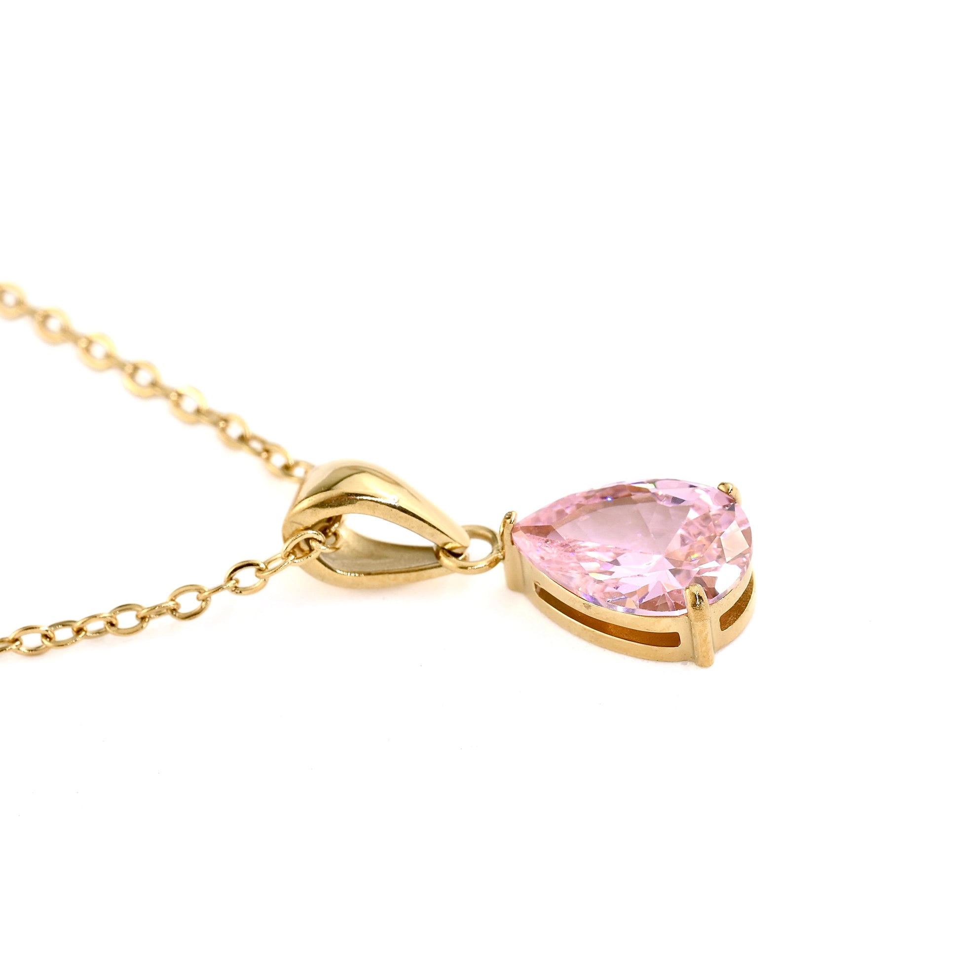 Gold necklace with a pink tourmaline teardrop pendant on a white background