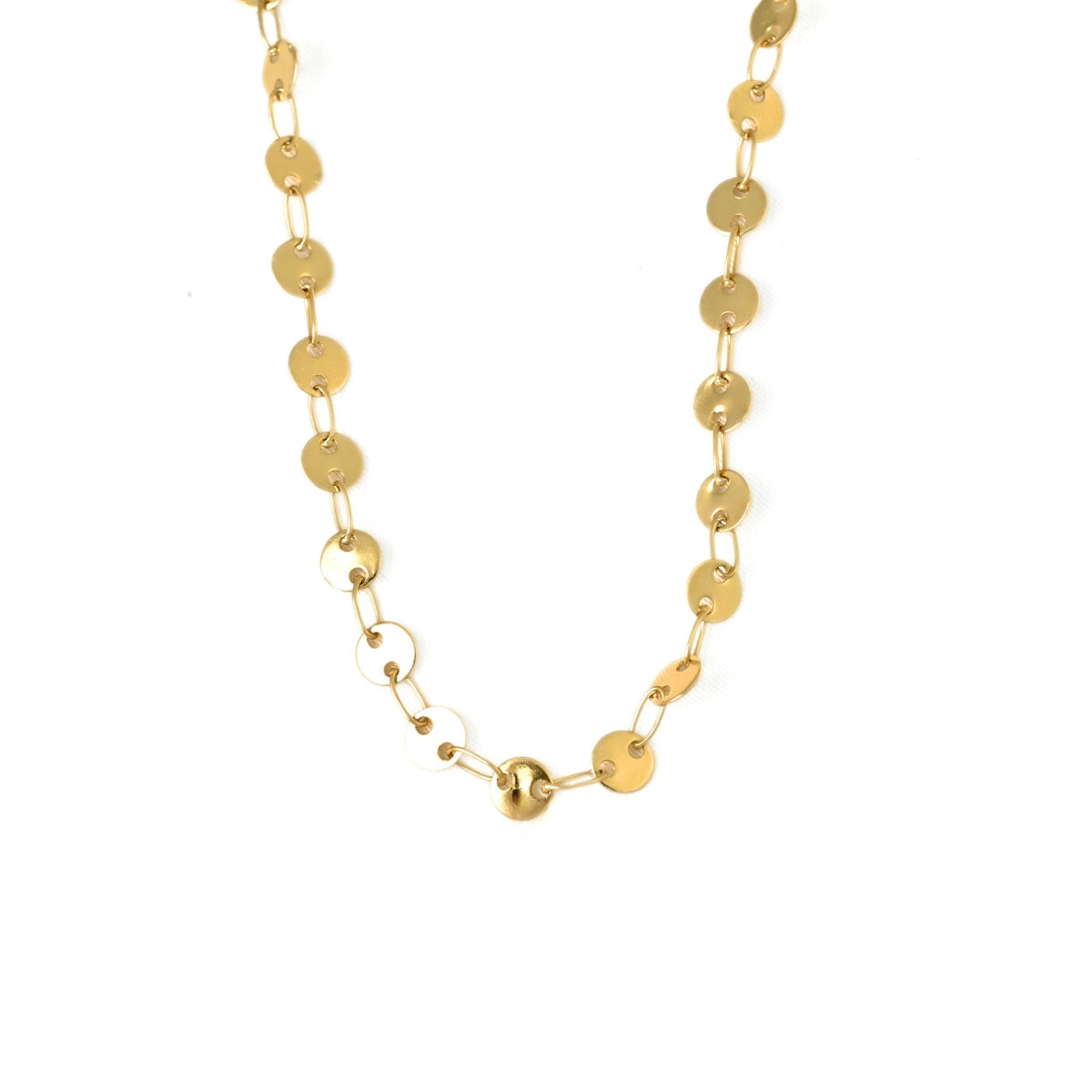 A gold chain necklace featuring flat circular disc links and one polished round bead at the center, displayed on a clean white background.