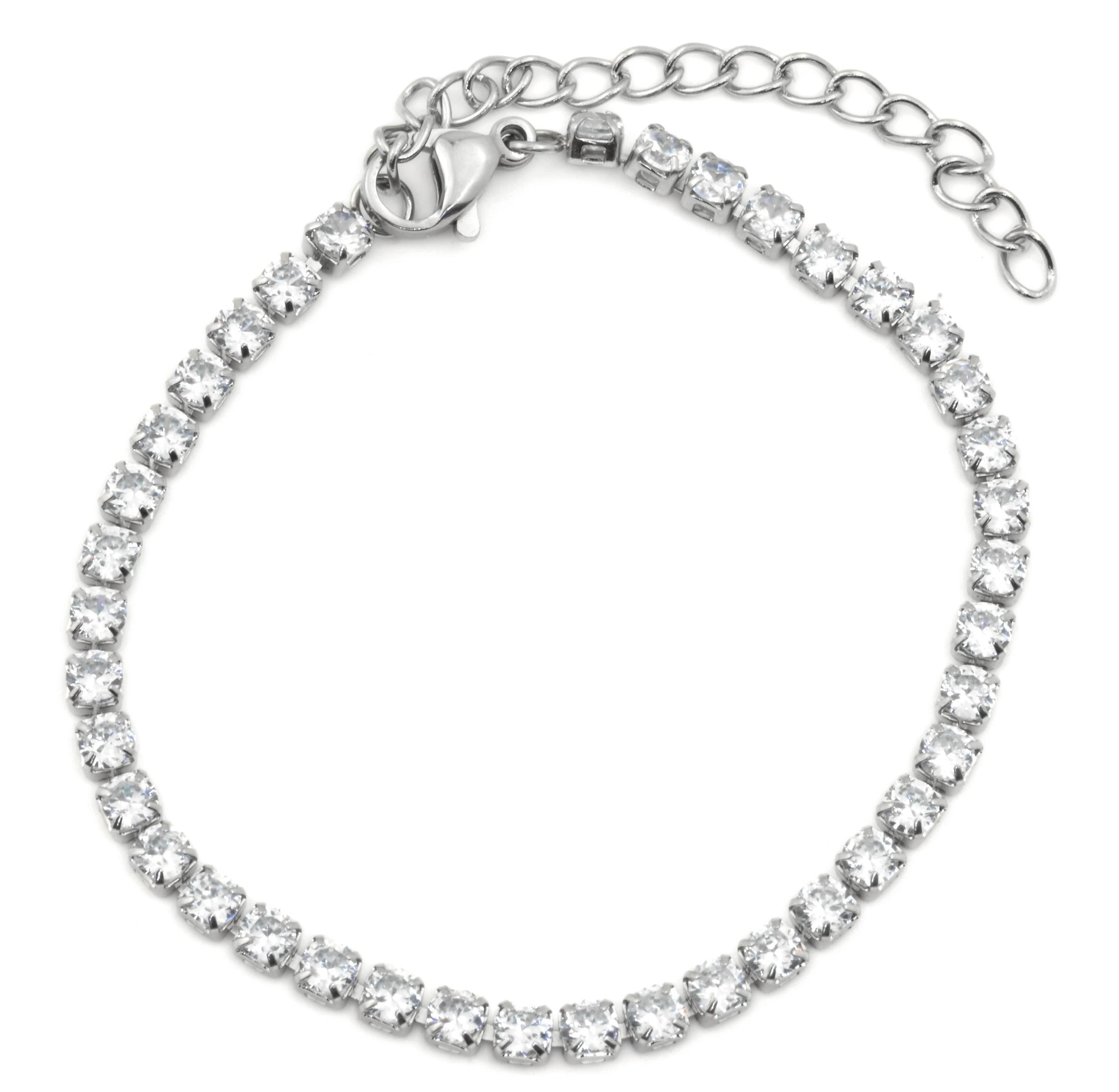 Top view of silver tennis bracelet with clear gemstones on a white background