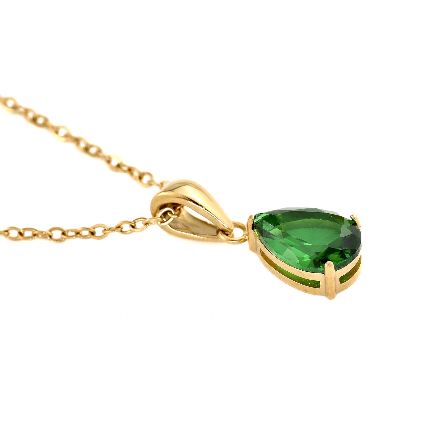 Gold necklace with a green gemstone pendant on a white background