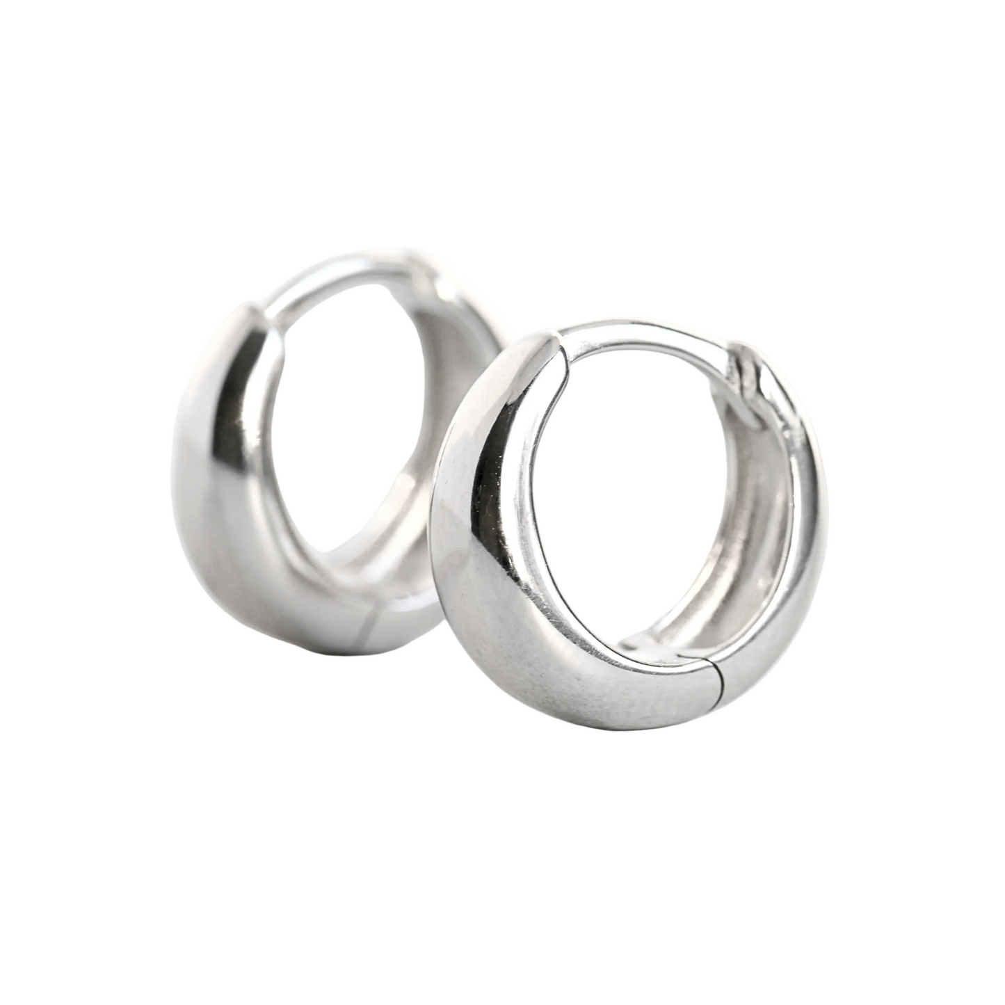 Pair of thick silver hoop earrings on a white background