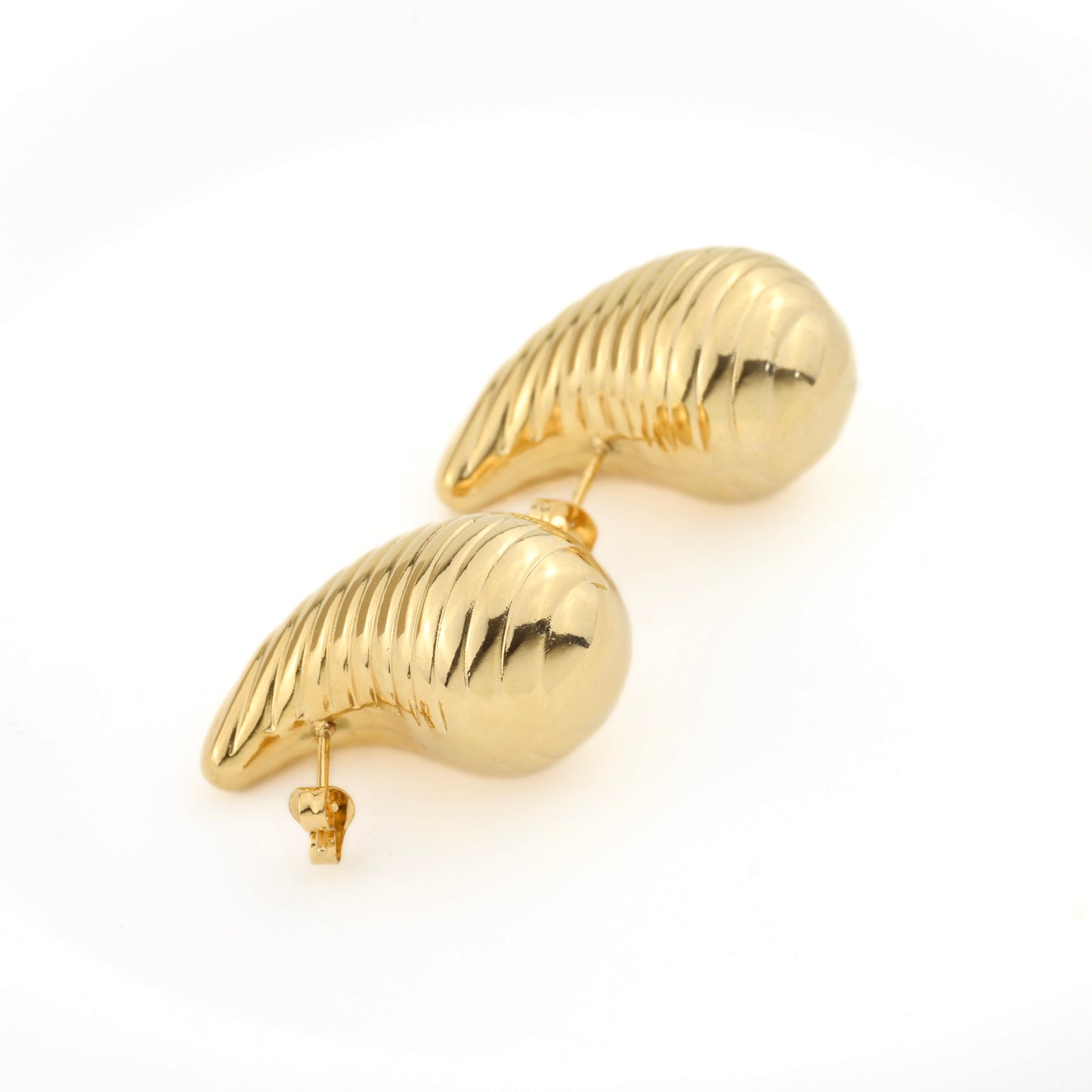 Gold shell-shaped earrings on a white background