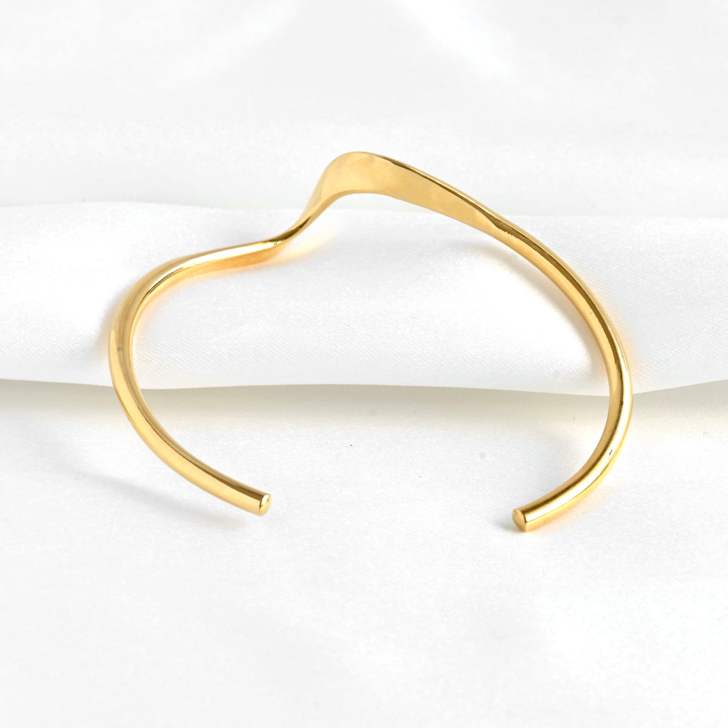 Back view of the gold sculptural cuff bracelet
