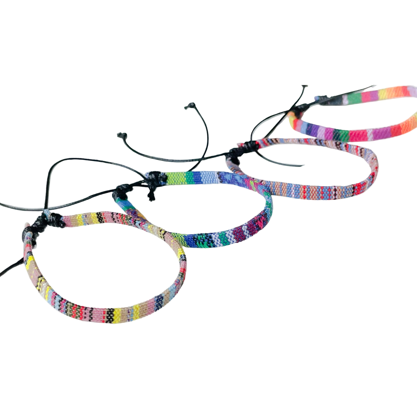 Colorful woven string anklets on a white background