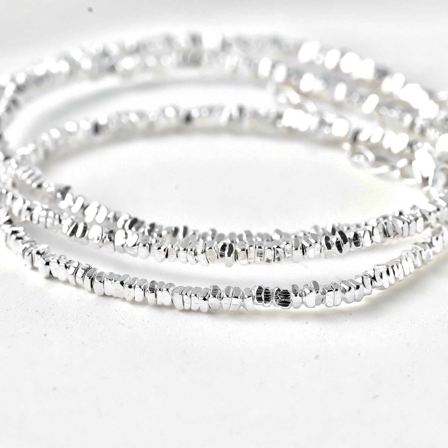 close-up of solid silver nugget beads forming the chain