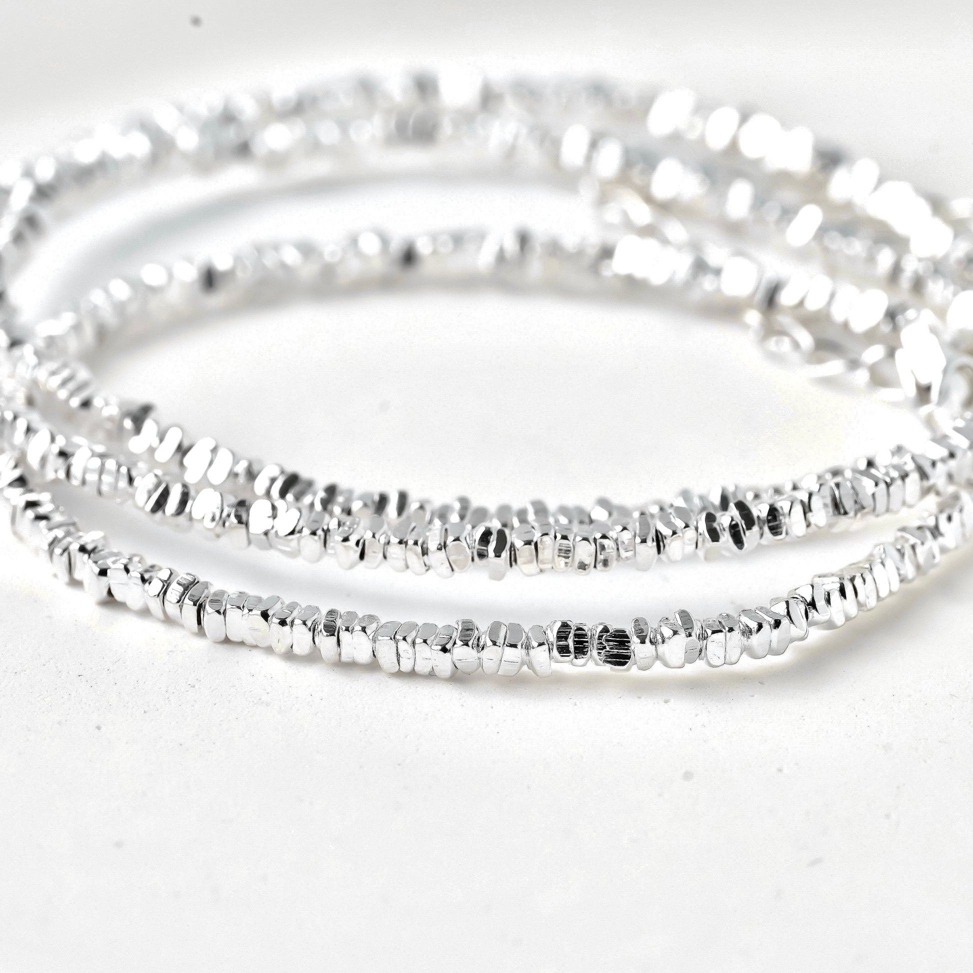 close-up of solid silver nugget beads forming the chain