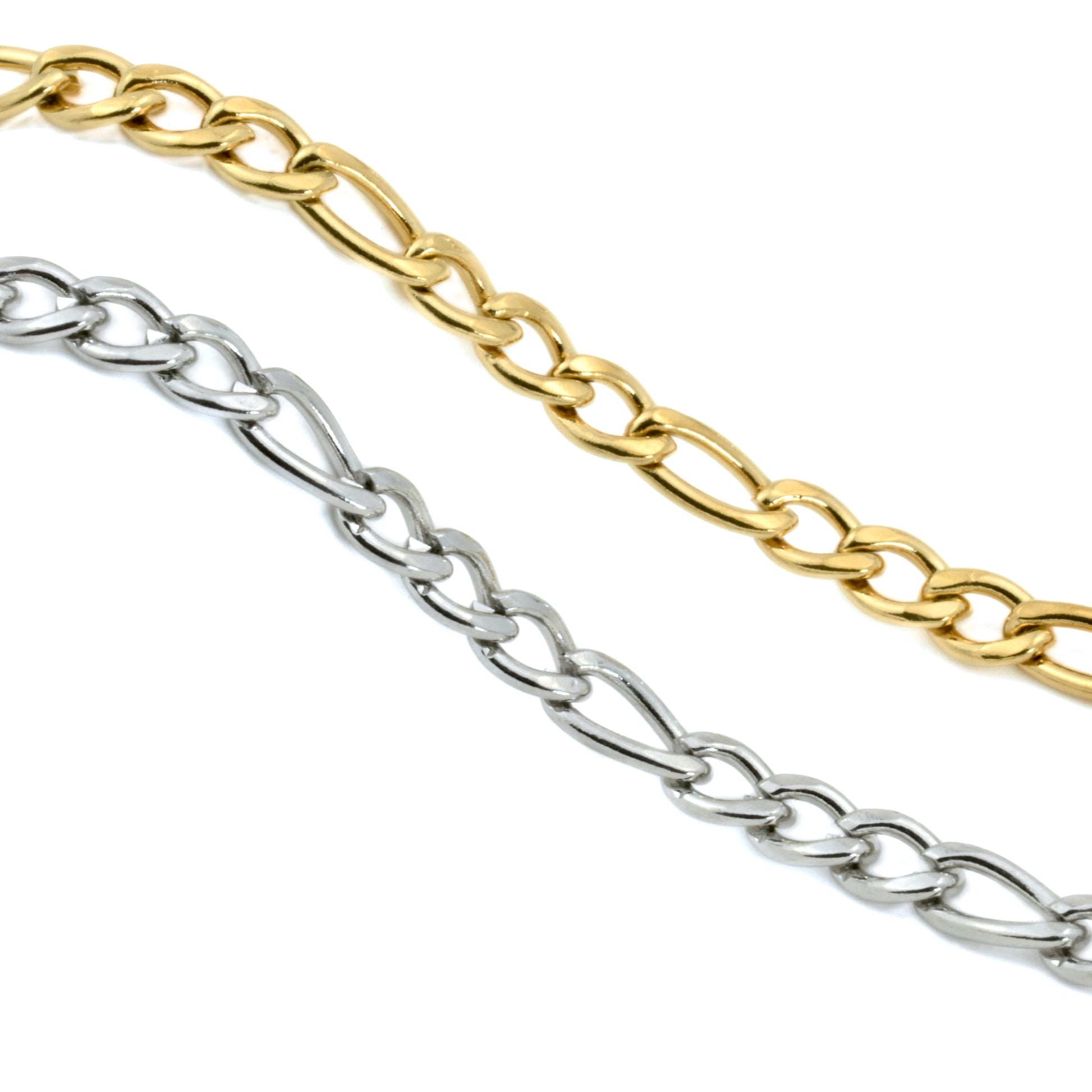 Two layerinf chain necklaces, one gold and one silver, on a white background.