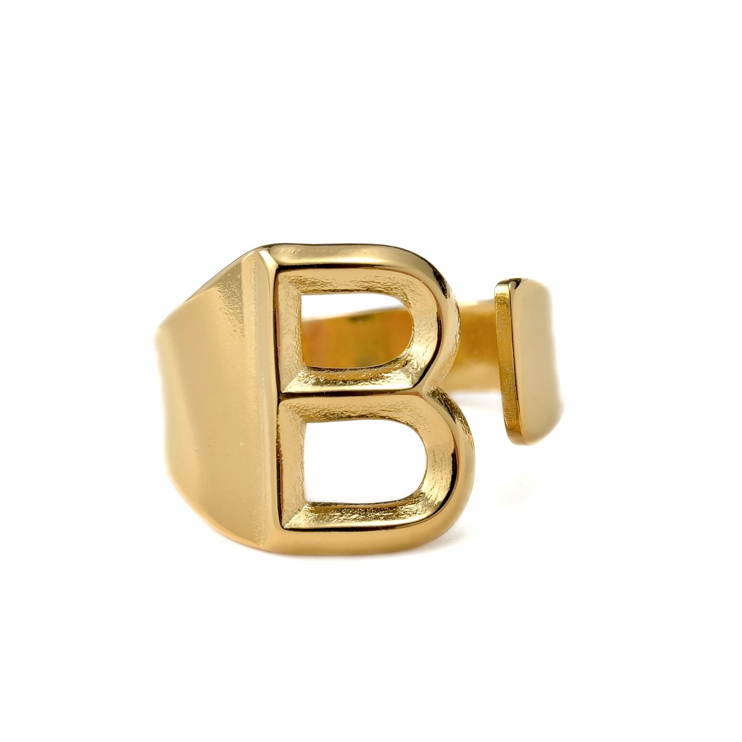 Gold ring with letter 'B' on a white background